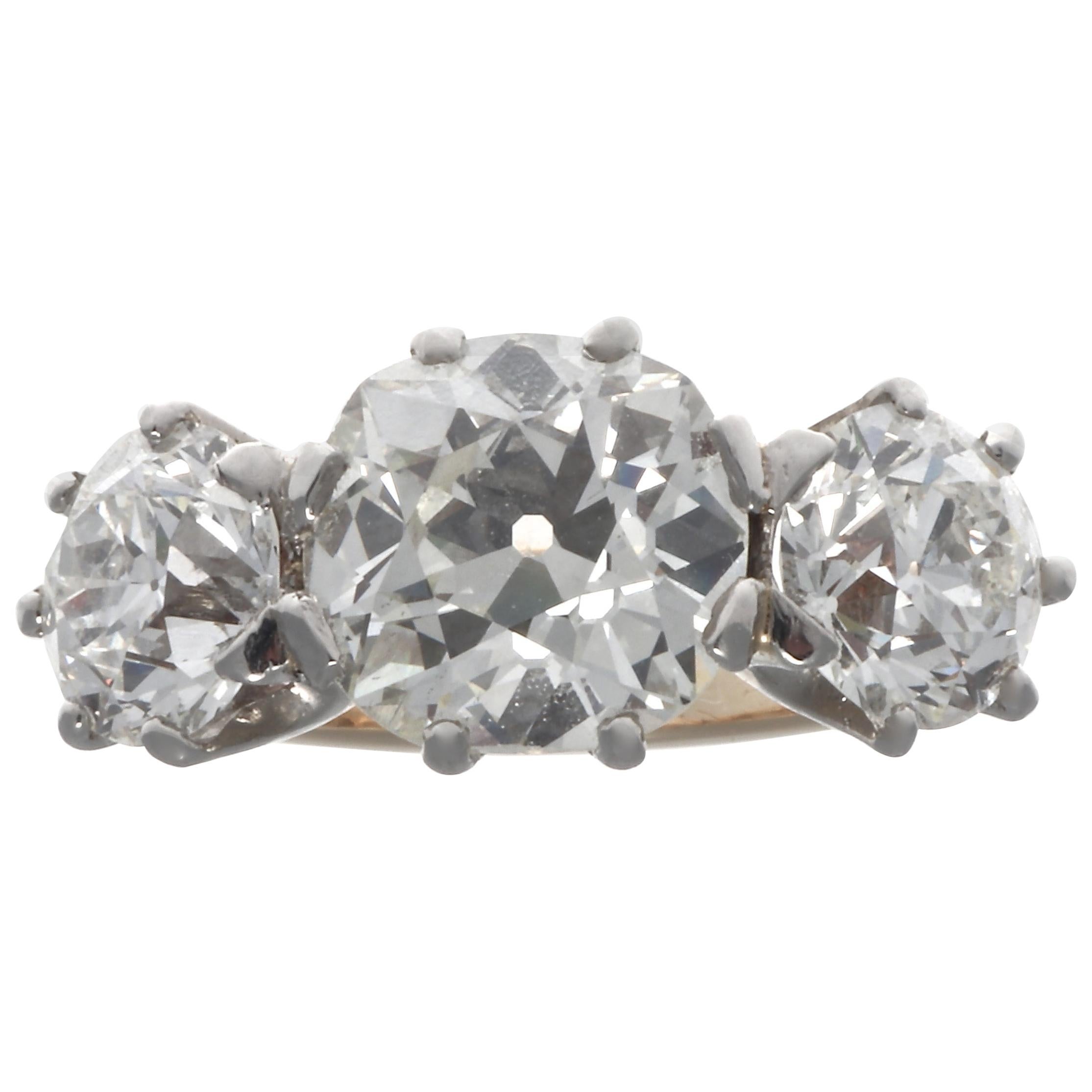 Antique GIA Three-Stone Diamond 18 Karat Gold Platinum Ring