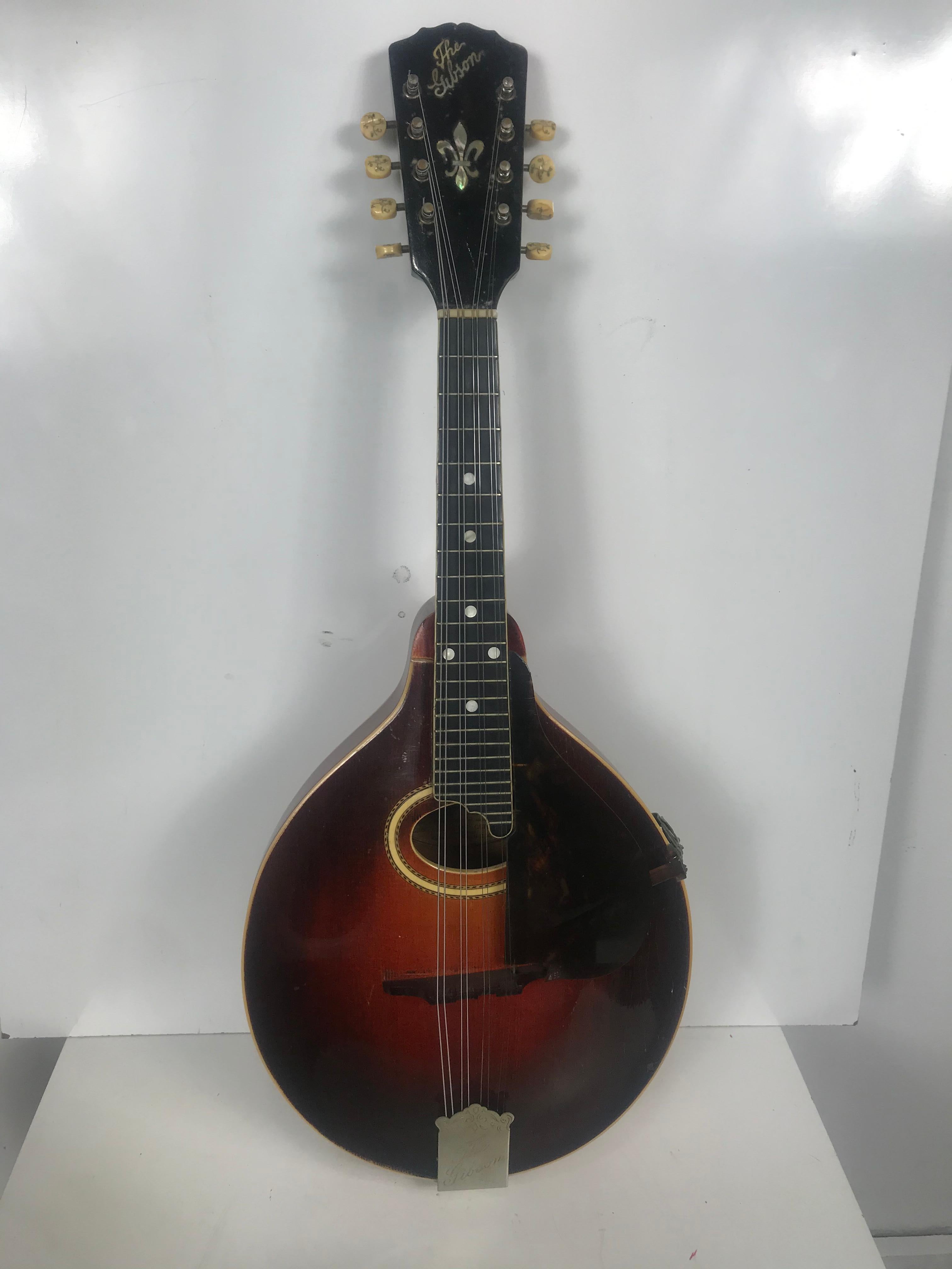 Antique Gibson circa 1917 A-4 Mandolin Sunburst.
This 1917 pumpkin top Gibson A-4 model mandolin is one of the nicest examples you’ll find. The old shellac finish is entirely original and in great shape. All original parts. Birch back and sides,