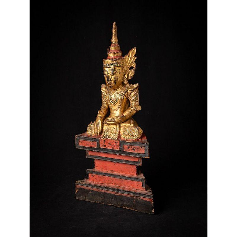 Material: wood
Measures: 54,5 cm high 
27, 5 cm wide and 11,5 cm deep.
Weight: 1.454 kgs.
Gilded with 24 krt. gold.
Shan (Tai Yai) style.
Bhumisparsha mudra.
Originating from Burma.
18th Century

