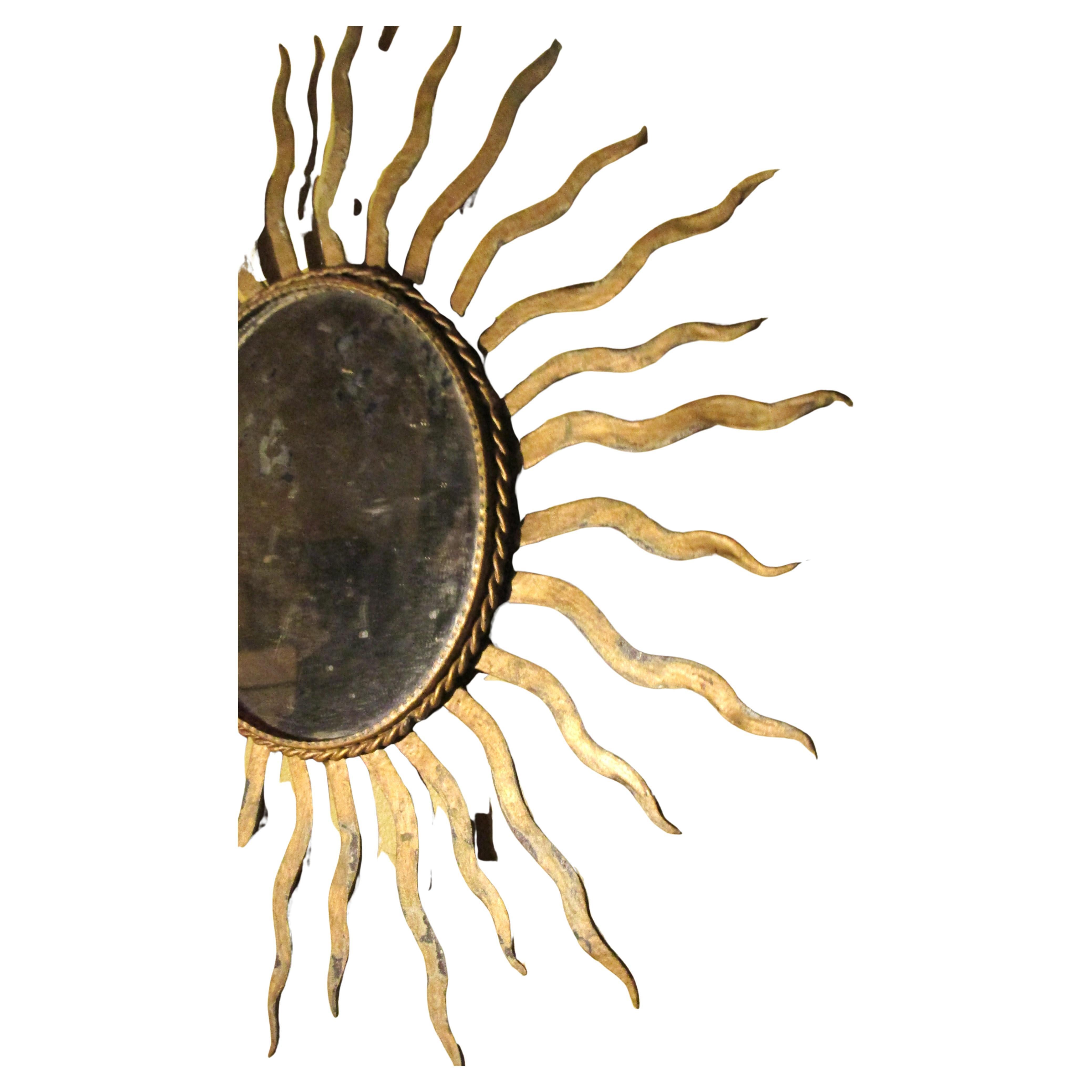 Beveled Antique Gilded Iron Sunburst Mirror For Sale