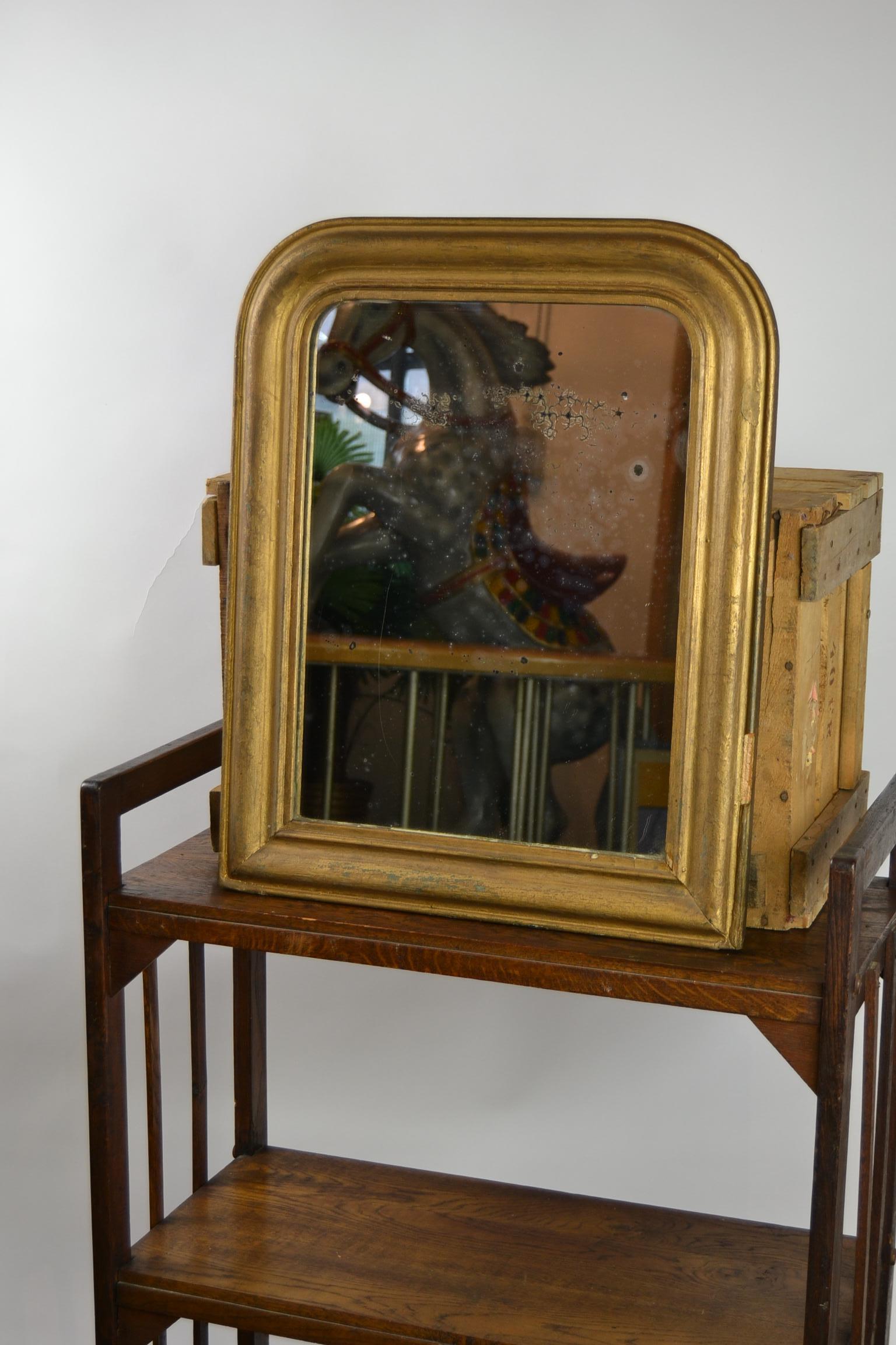 Antique French Gilded Mirror Louis Philippe style.
This mirror from France has a gilded frame from wood and plaster,
a great worn Pattina on the Mirror glass, and a wooden back.
It has traces of age and use, but for his age not strange. This used