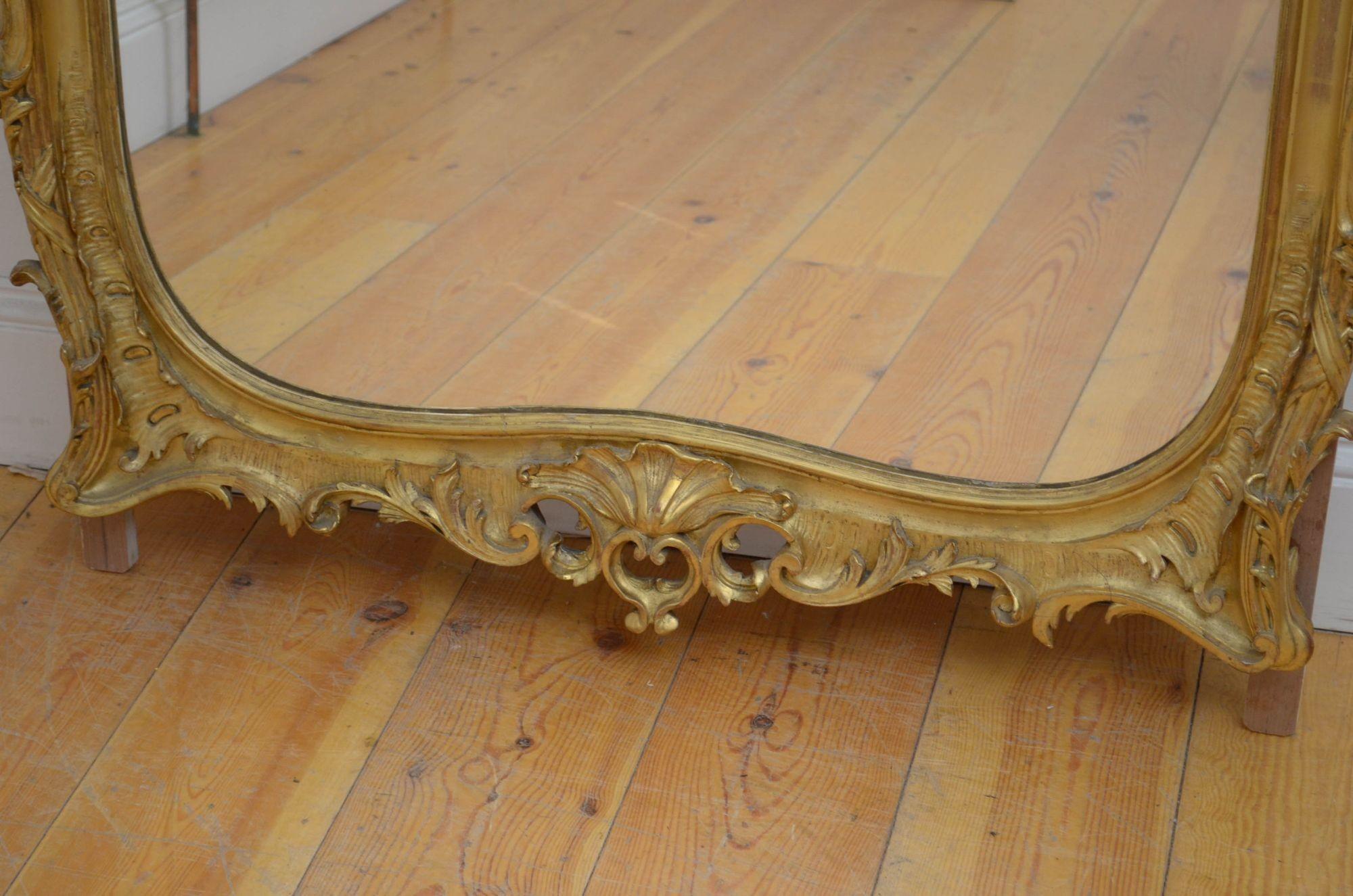 Sn5398 Exquisite 19th century giltwood wall mirror, having original glass with some imperfections in gilded frame decorated with cluster columns, bows leafy scrolls all with elaborate shell crest to the centre. This antique mirror is in home ready
