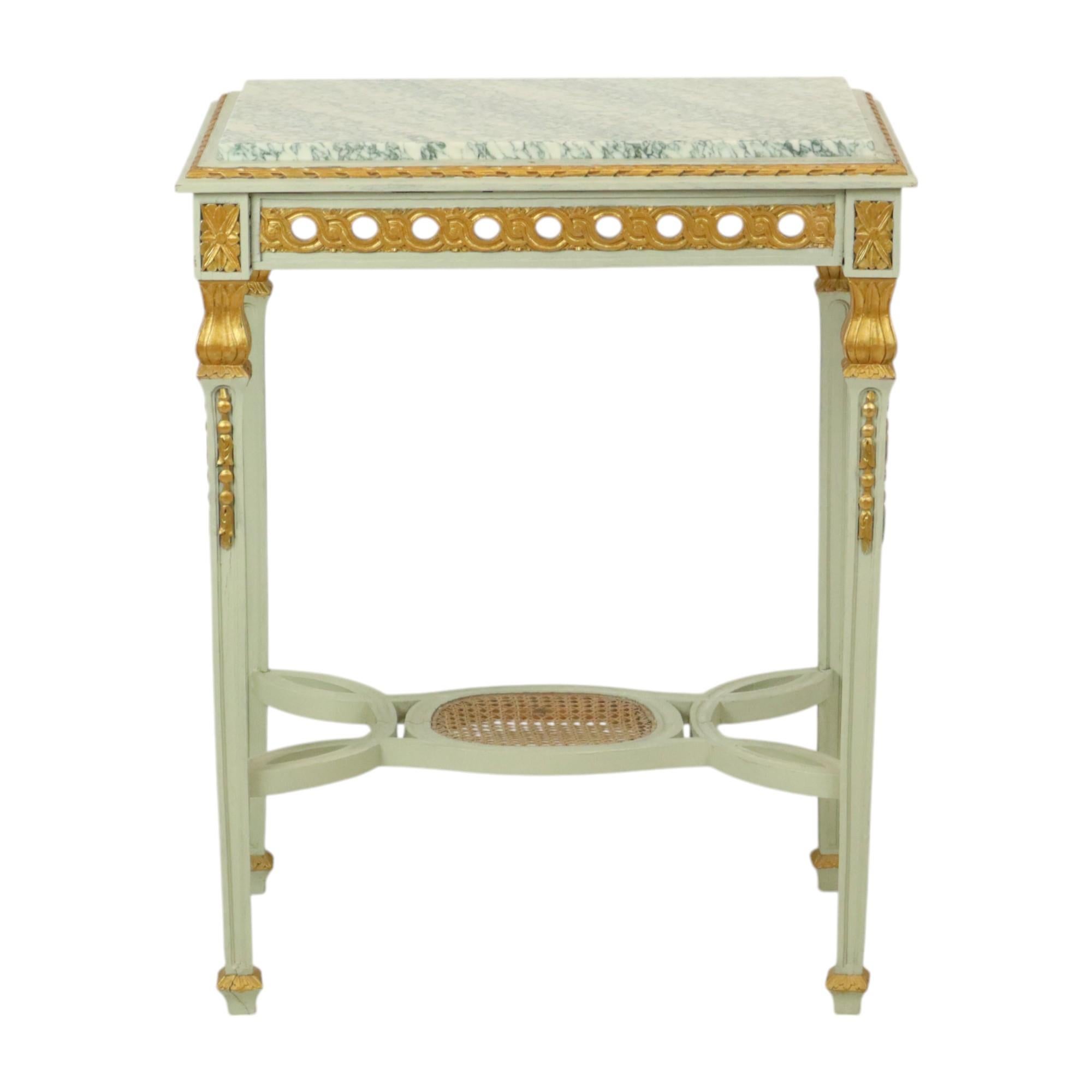Beautiful antique side table, narrow console table made entirely of lacquered and partly gilded wood, with a beautiful marble table top, completely in Louis XVI style, circa 1900 or earlier, France.

This rare French side table has a beautiful
