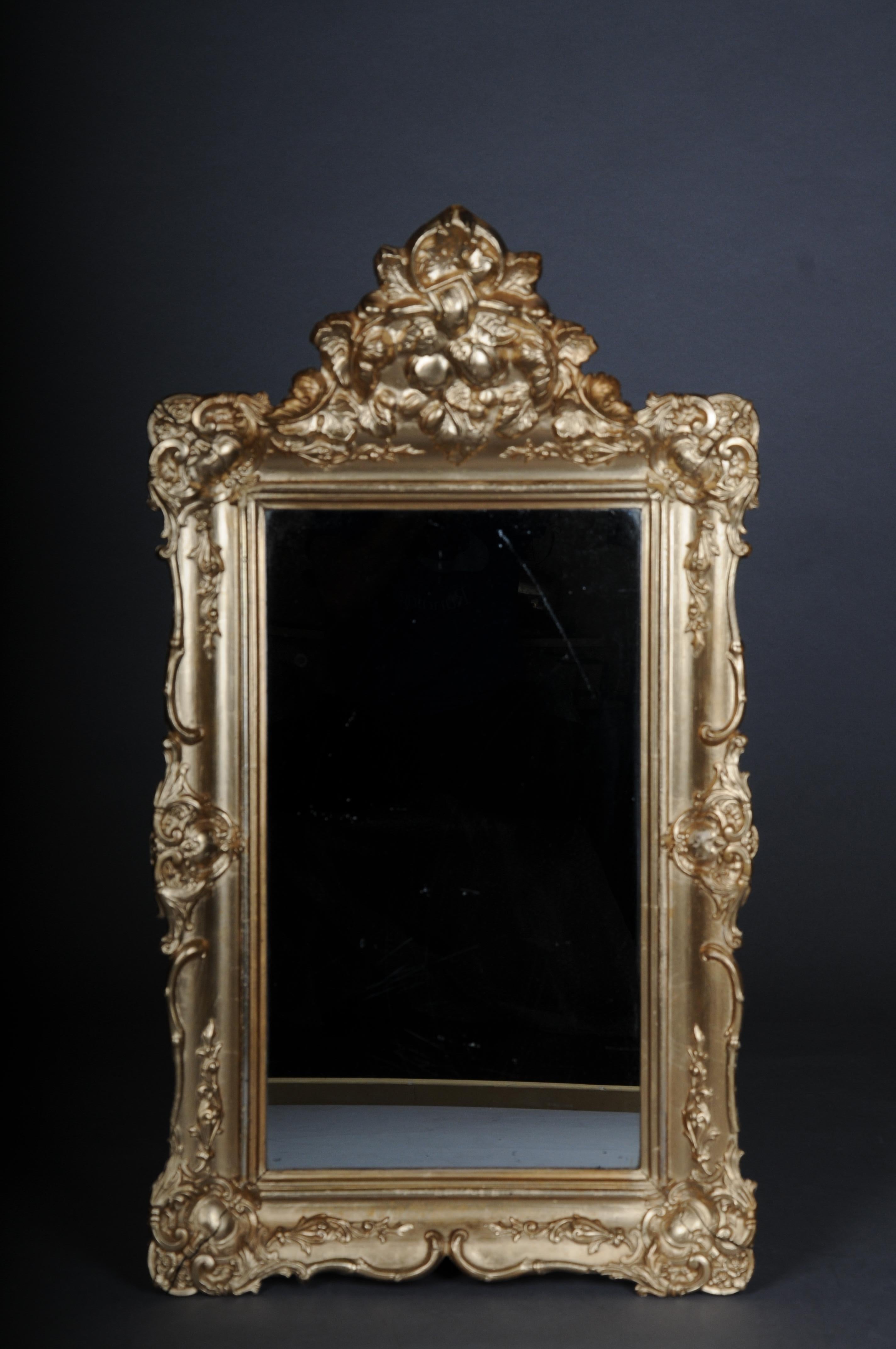 Antique gilded wall mirror, Germany around 1870

Rectangular gold frame with high lavish crowning. Ornate frame.
Germany around 1870
