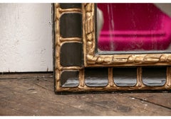 Antique Gilt And Ebonized Italian Mirror