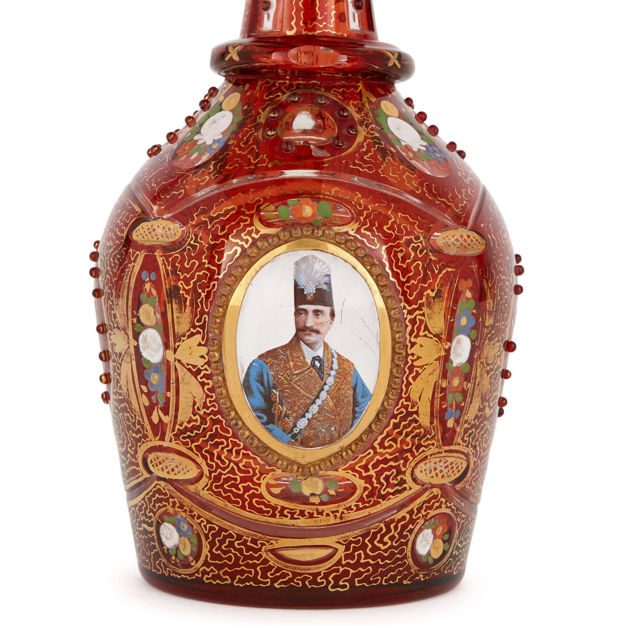 This exquisite ruby glass decanter was crafted in the late 19th century in Bohemia, a historic region which was famous for its glassware. Antique Bohemian glass is today considered highly collectable because of its high-quality craftsmanship and