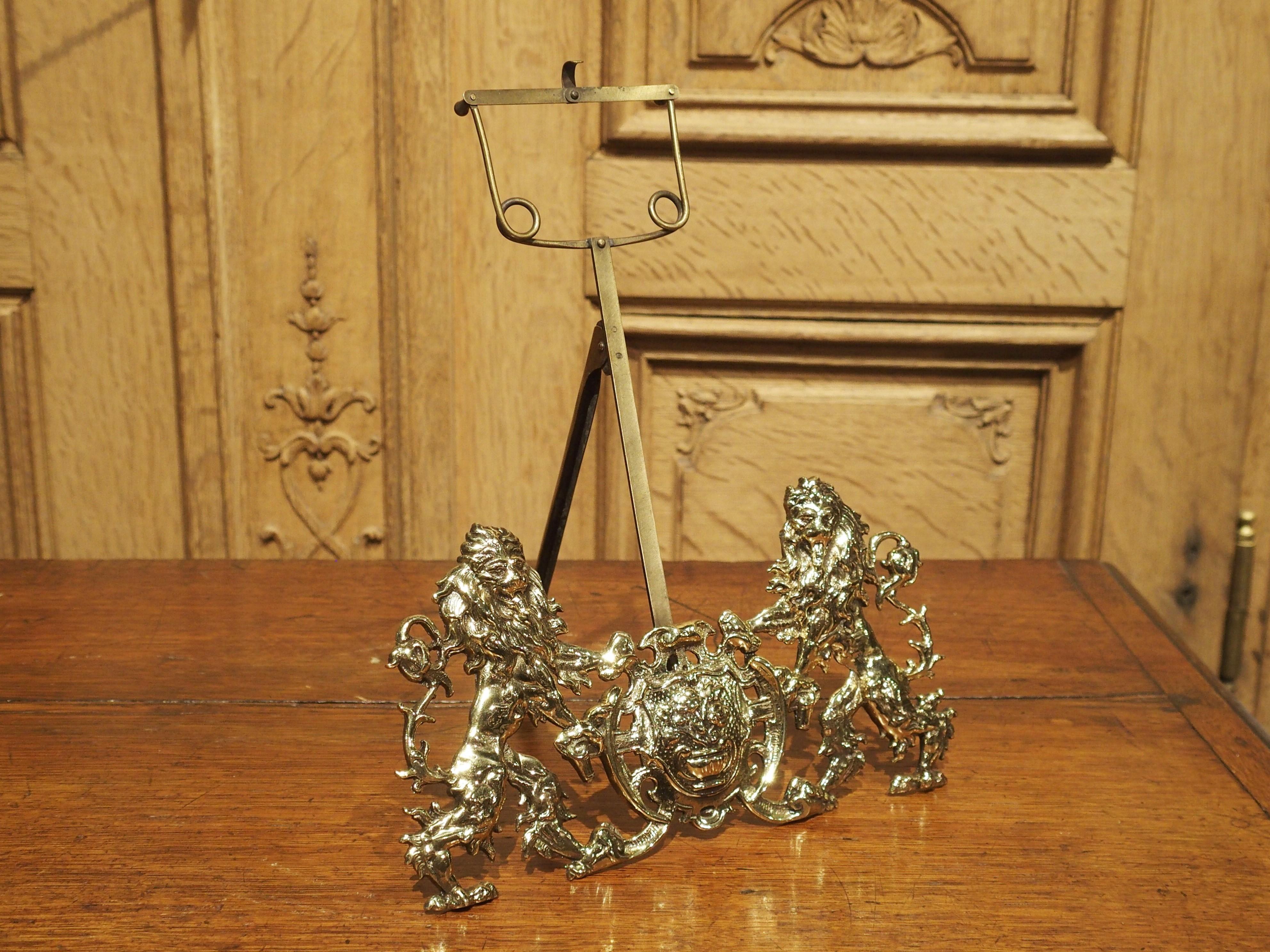 This decorative coat of arms music sheet holder is made from lightly gilt bronze and brass and was produced circa 1870.

Supported by an easel stand, our antique music sheet holder shows a heraldic coat of arms. Two lion supporters are holding up