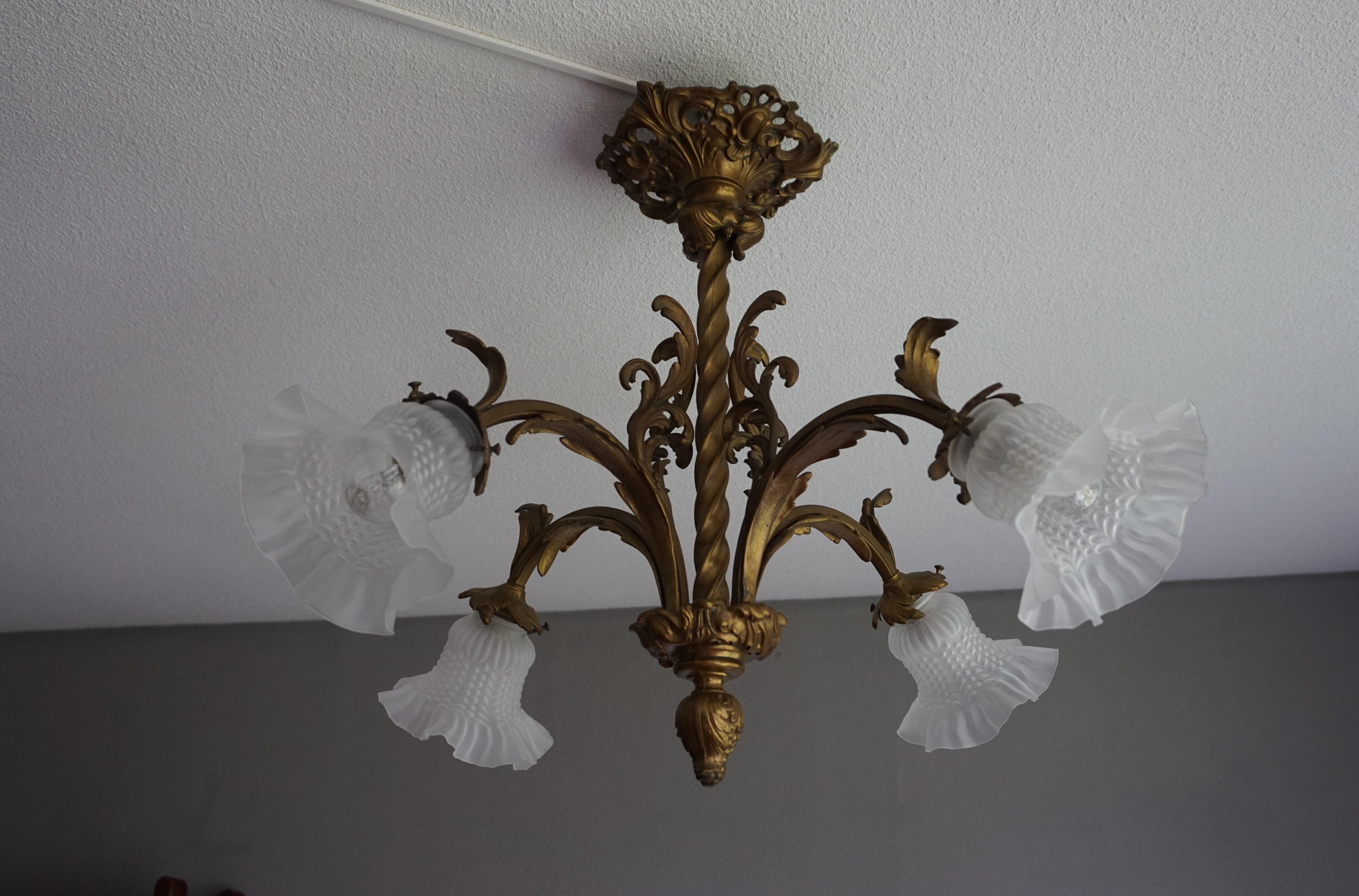 Stylish and beautifully hand-crafted, 4 light chandelier.

If you are looking for a stylish antique light fixture that brings beauty and a good amount of light above your dining table or in any other room then this four light chandelier of wonderful