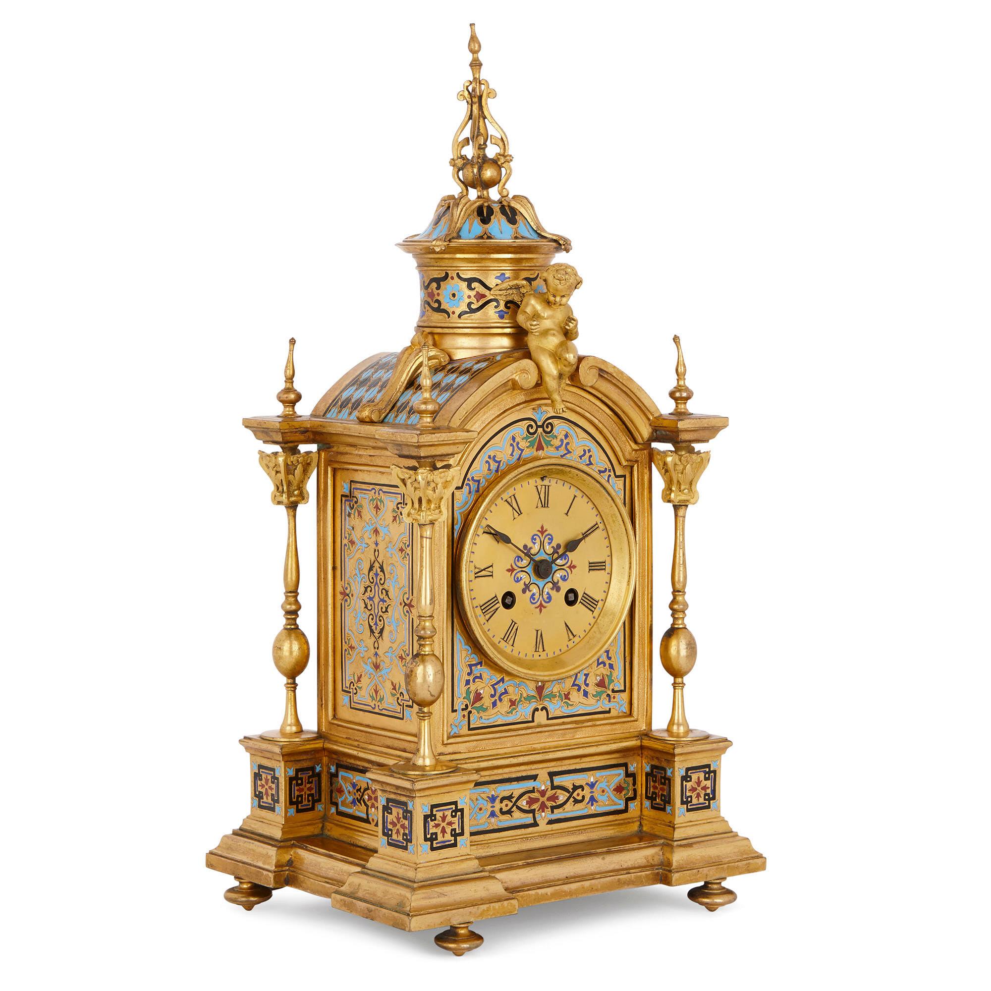 This beautiful clock set, which comprises of a mantel clock and a pair of vases, was designed in France in circa 1870 in a wonderful Renaissance Revival style. The set has been crafted from gilt bronze (ormolu) and ornately decorated with champlevé