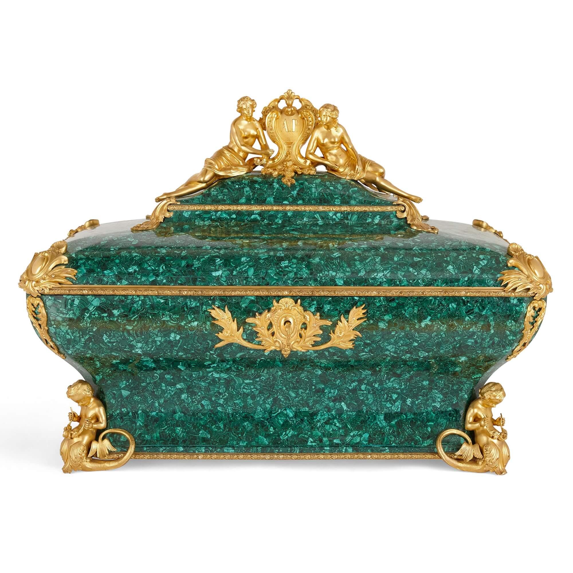 Antique gilt bronze and malachite casket by Monbro Fils Ainé
French, mid 19th Century
Measures: Height 68cm, width 92cm, depth 52cm

This marriage casket is a wonderful piece of nineteenth century French design. The casket is wrought from