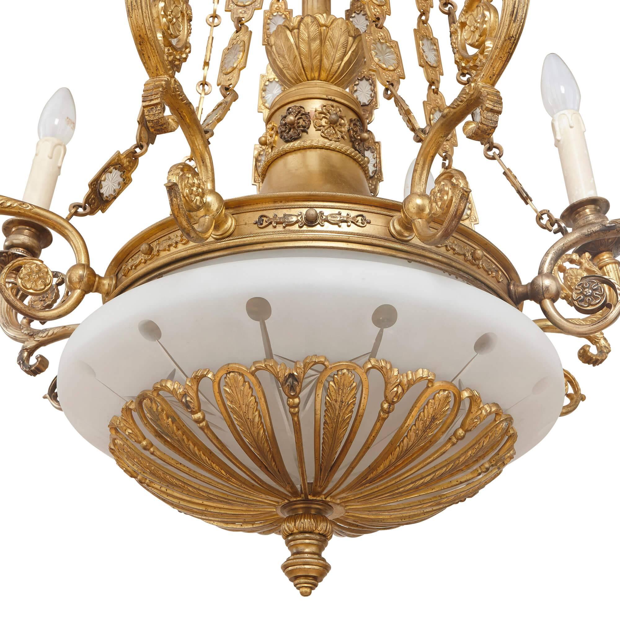 This beautiful, tall chandelier is ideal for a grand entrance hall or room where it can be seen and admired. It is an exceptional piece of Empire style design, perfectly combining glass and gilt bronze, with a sumptuous simplicity and