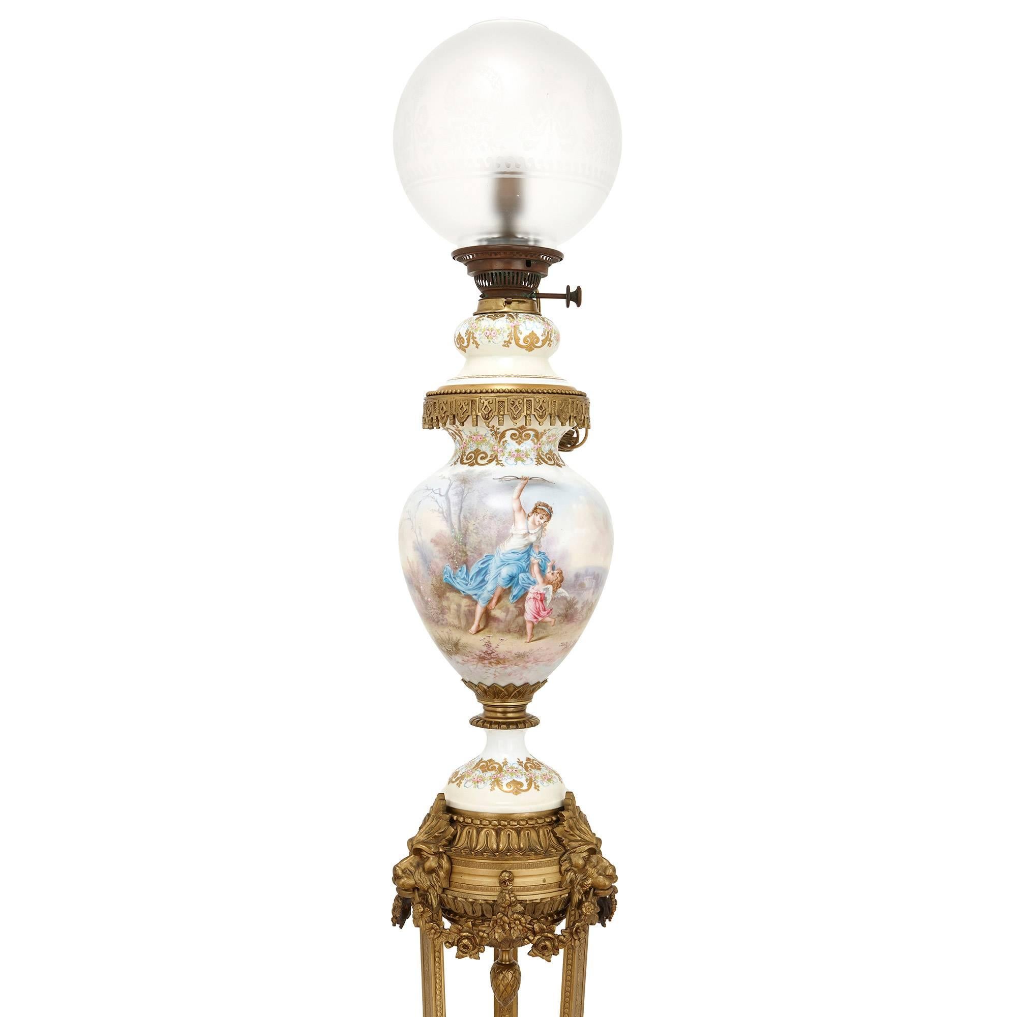 This French floor standing lamp- tall, slender and sophisticated- is crafted of Sevres style porcelain and extensively mounted with intricately cast gilt bronze. 

The lamp body is crafted as an ovoid form porcelain vase, which is delicately