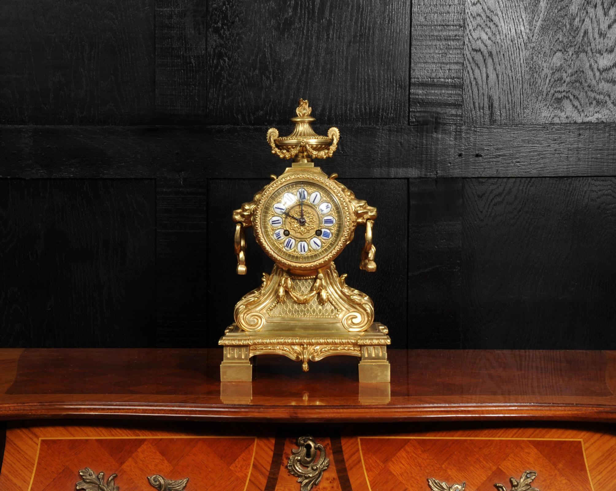 A superb Louis XVI style gilt-bronze mantel clock, of architectural and classically inspired form, exquisitely cast and finely chased throughout. The movement is mounted in a bronze drum with lions mask handles, superbly modelled with flowing manes