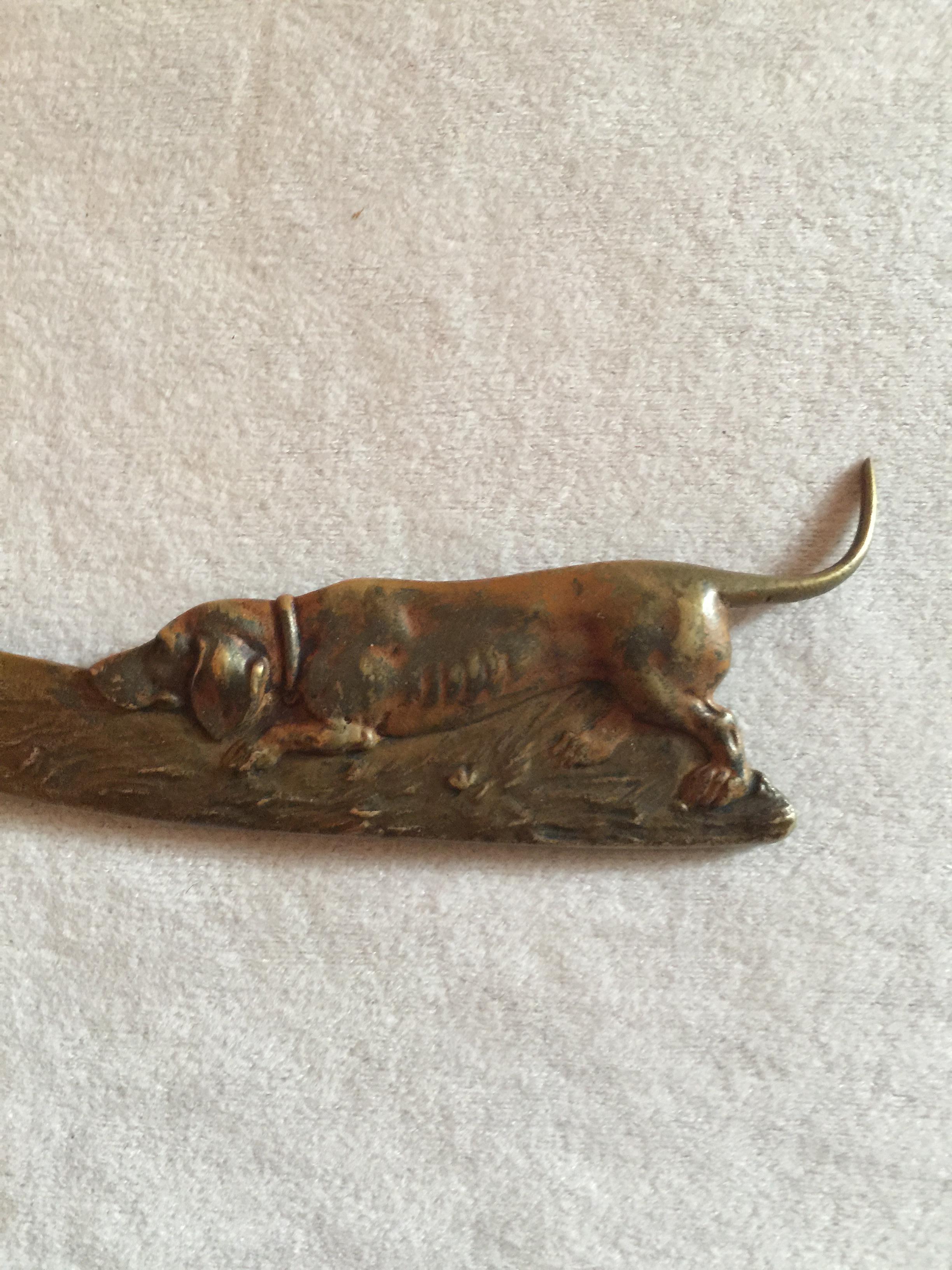 We bought a nice collection of letter openers and a few were very special, this is one of them. A nice presentation of an adorable dog moving along on the handle portion of the letter opener. Extremely well cast and it's all there, no broken tail,