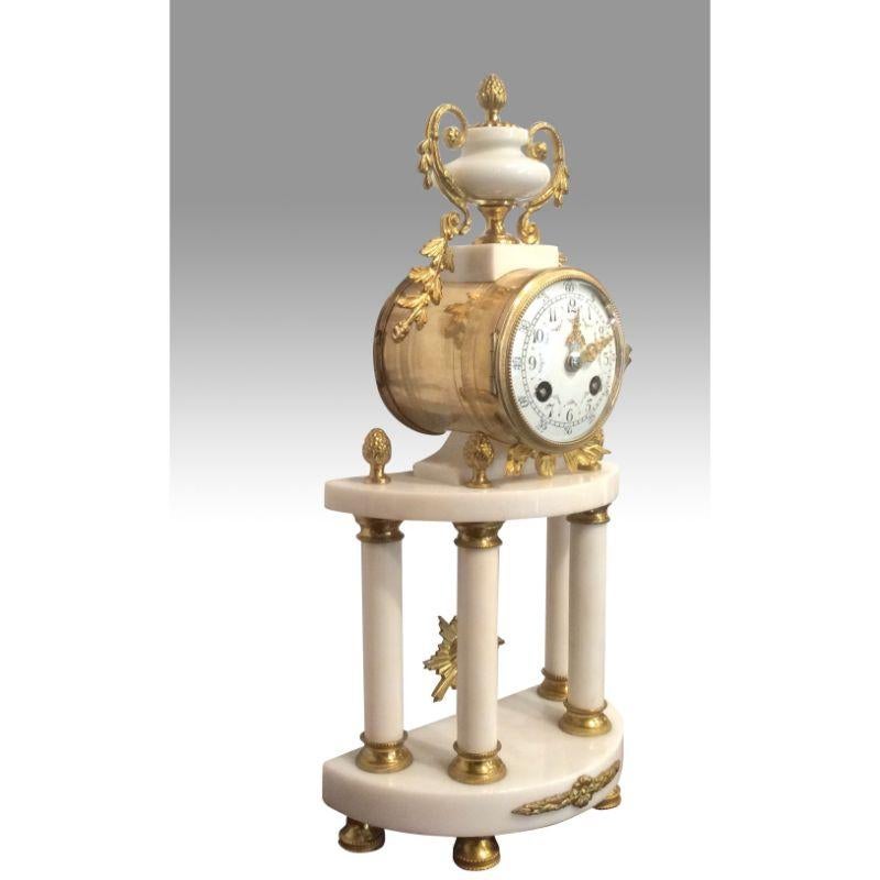 Antique marble and gilt bronze marble mantel clock set 

A beautiful antique 19th c French gilt ormolu bronze & White Carrera marble portico mantel clock set by Japy Freres 
Very impressive and beautiful Clock set in prestine condition. Very high