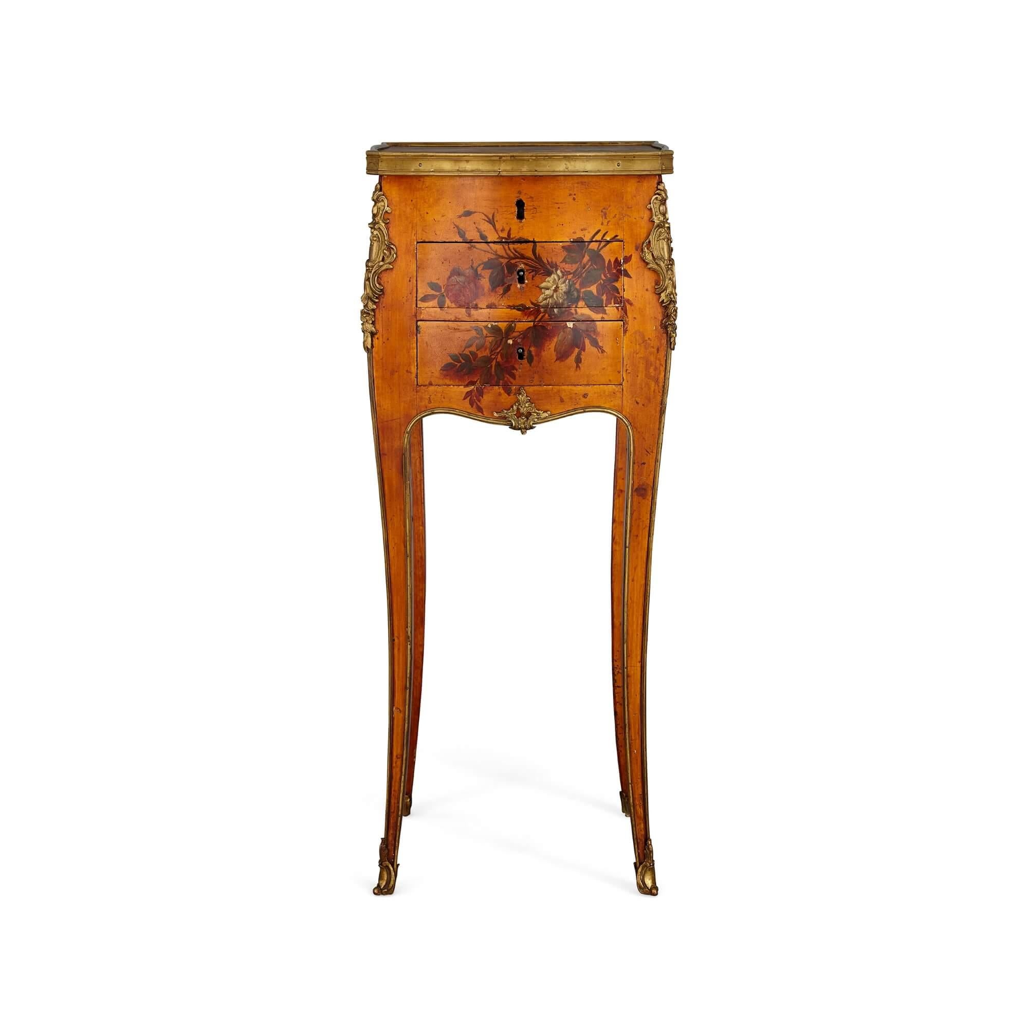 Antique gilt bronze mounted French side table
French, c. 1900
Height 74cm, width 30cm, depth 30cm

This refined and elegant side table is set on four, slender cabriole legs with hoof feet mounted with gilt bronze. The table features a slight bombé