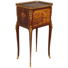 Antique gilt bronze mounted occasional table with marquetry panels