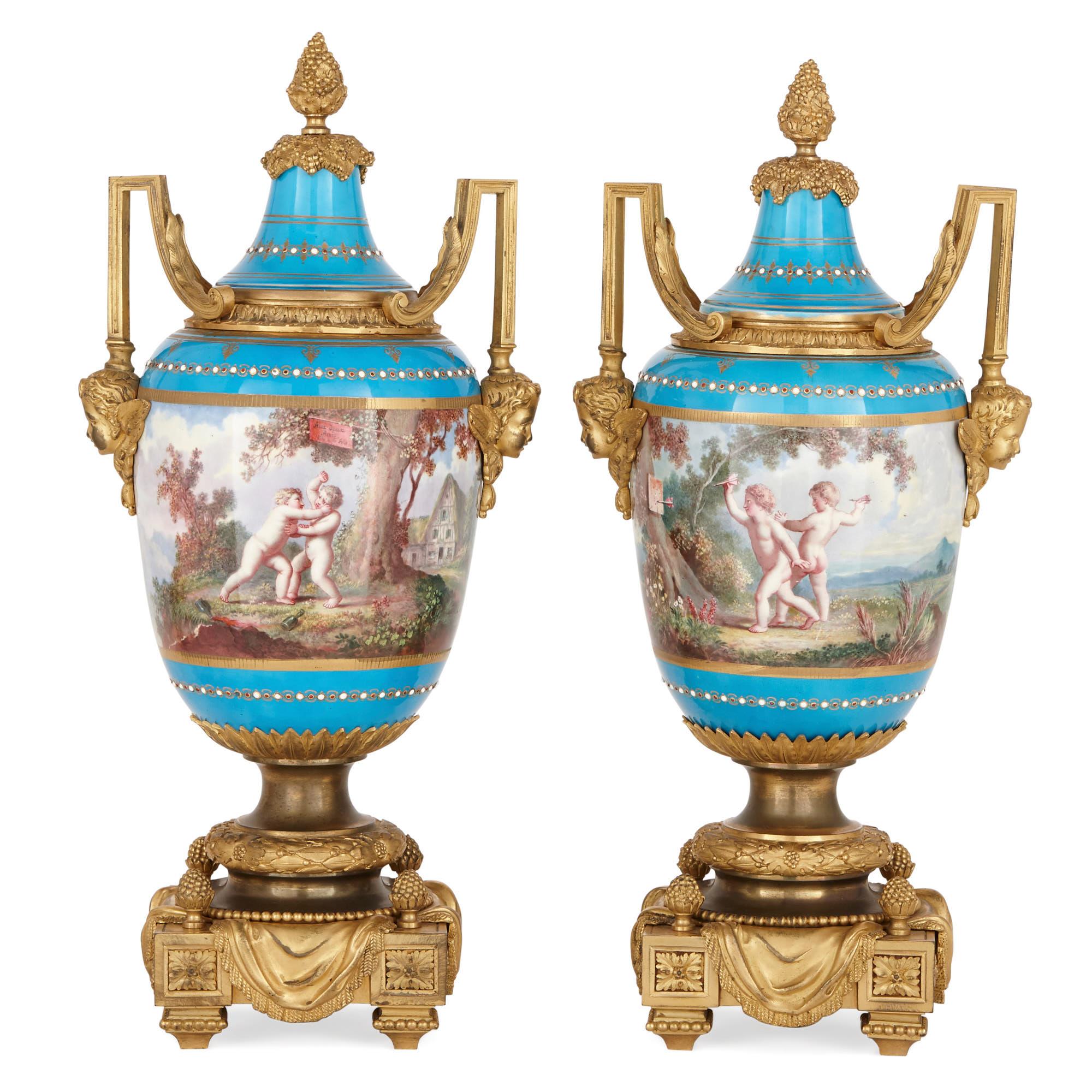 With its exquisite paintings of putti playing sports in Arcadian landscapes, this ‘bleu celeste’ garniture demonstrates the exceptional beauty and high-quality craftsmanship of Sevres factory porcelain. In addition to this, the porcelain vases are