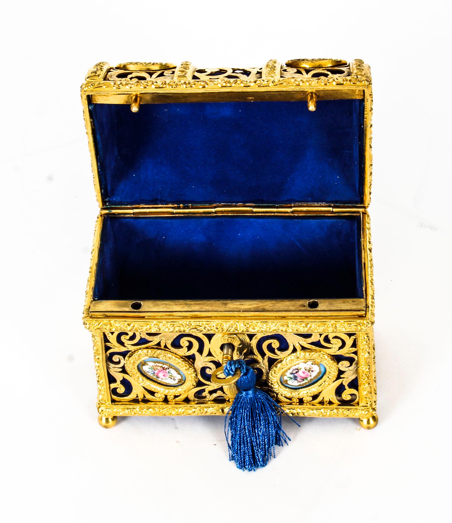 This is a stunning antique 19th century French Palais Royal gilt bronze and Sèvres porcelain mounted domed rectangular table casket, circa 1870 in date. 

The locking cover with swing handle, enclosing a Royal Blue velvet-lined interior, the whole