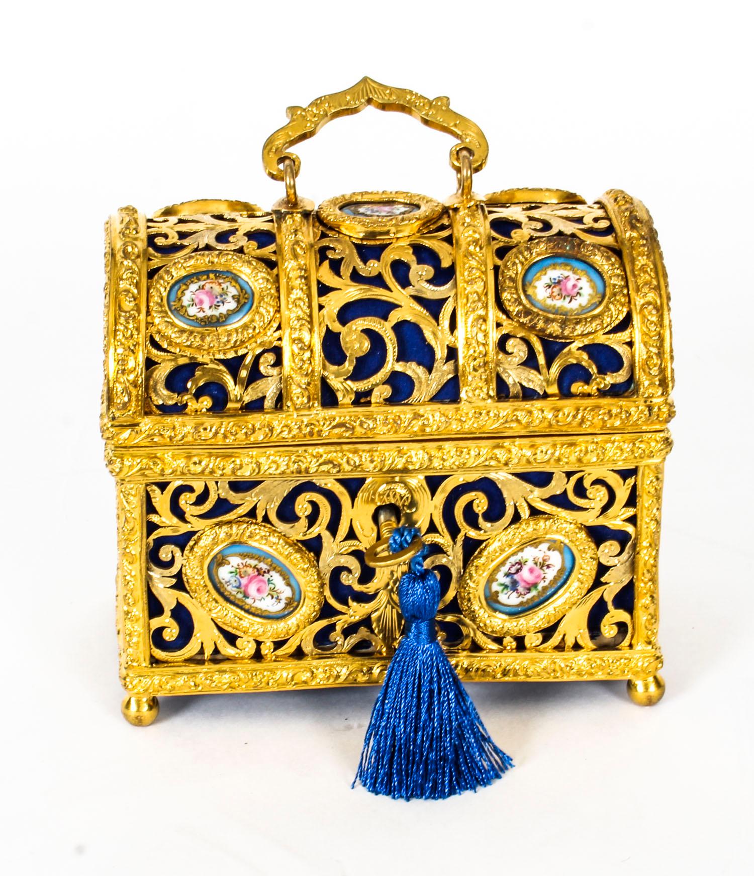 This is a stunning antique 19th century French Palais Royal gilt bronze and Sevres porcelain mounted domed rectangular table casket , Circa 1870 in date. 

The locking cover with swing handle enclosing a Royal Blue velvet-lined interior. The whole