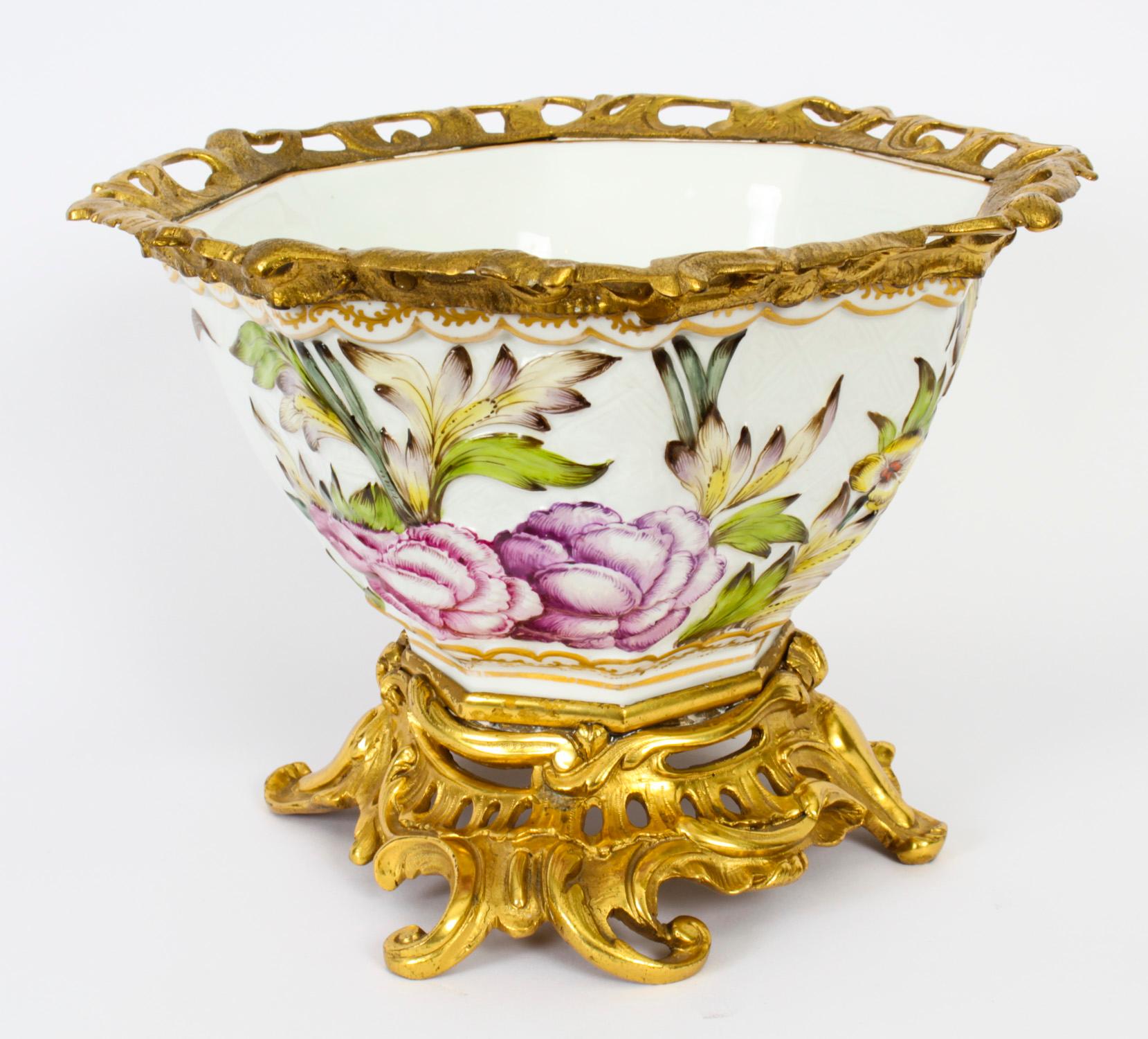 This is a fine antique French Samson porcelain centrepiece, Circa 1860 in date.
 
The octagonal shaped centrepiece features a colourful relief body decorated with flower sprays and a Chinese dragon. It is raised on a heavy set pierced and scrolled