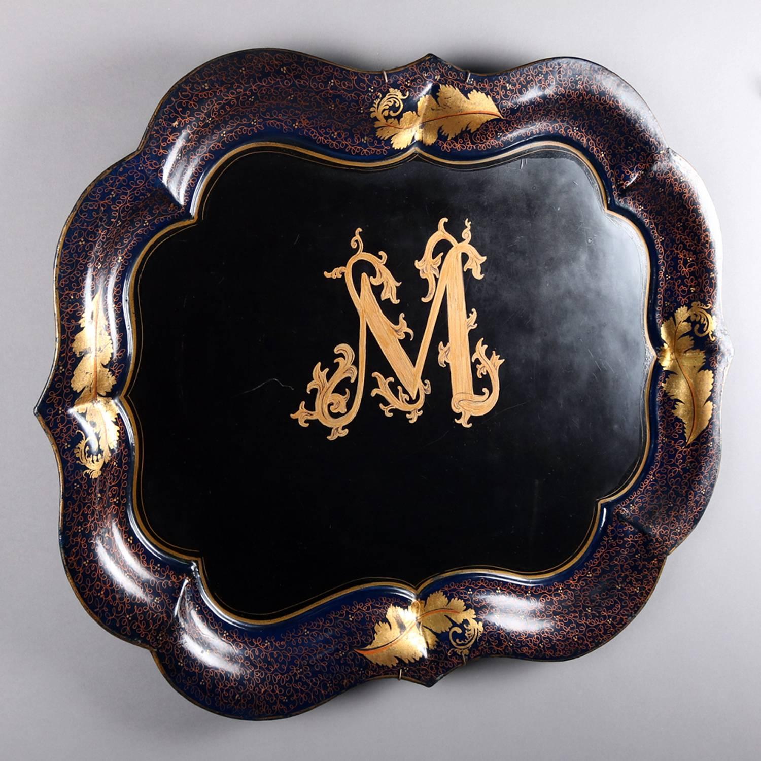 Antique tole ware serving tray features scalloped form with hand-painted gilt central 