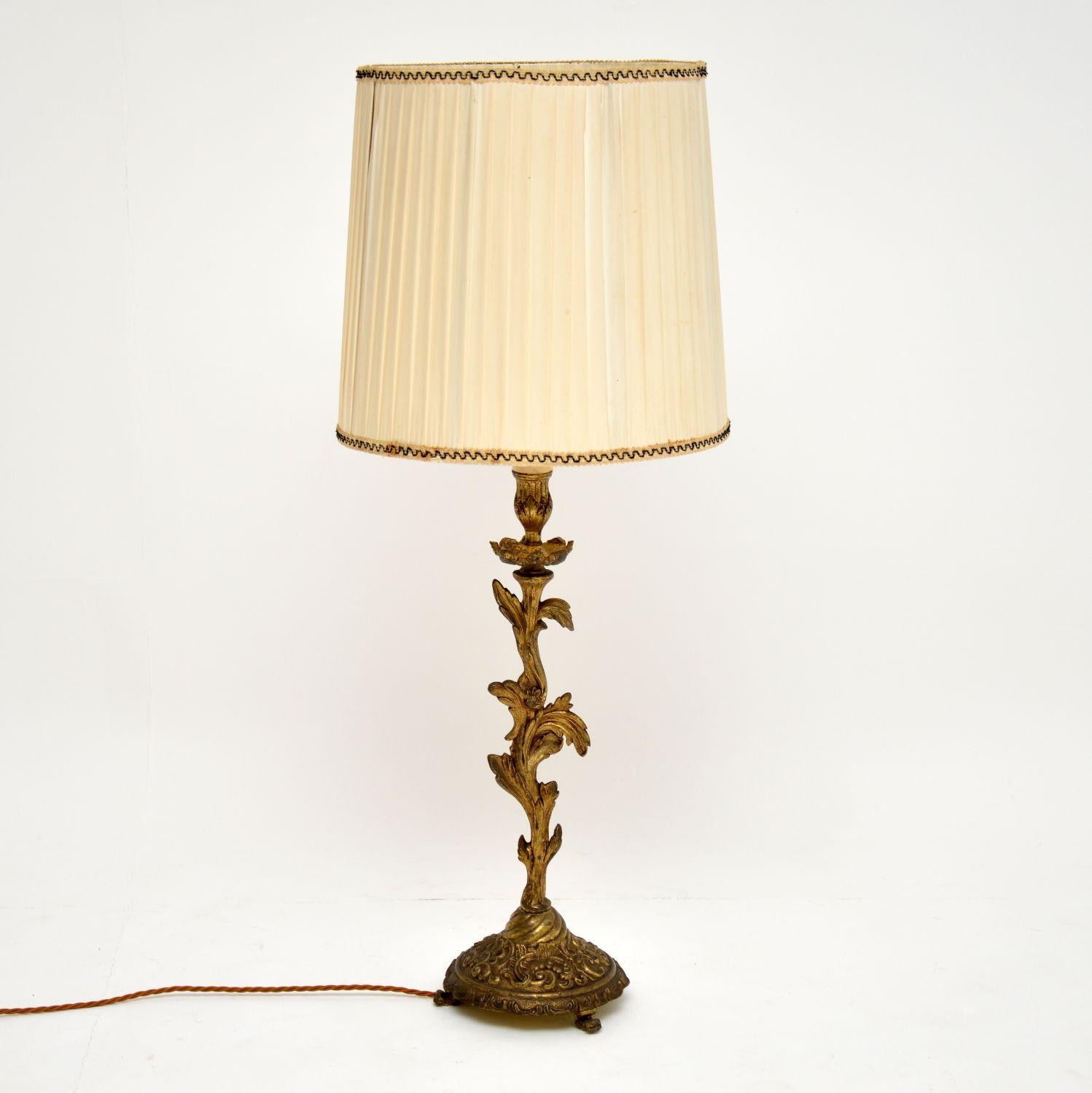 Antique gilt metal table lamp in good original condition, dating from circa 1930s period. We have just had it re-wired, so it’s in good working order. I believe this lamp is French and it’s well cast with some nice details. We have added the old