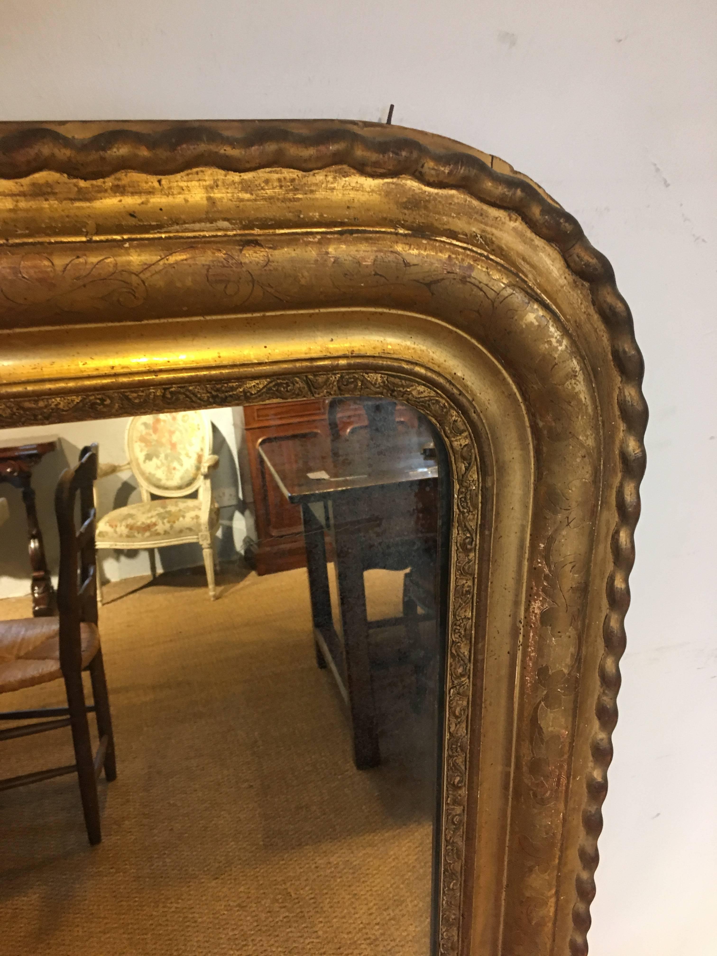 Late 19th century gilt mirror, original back boards 

Measures: Height 51 inches or 130 cms 
Width 39 inches or 100 cms.