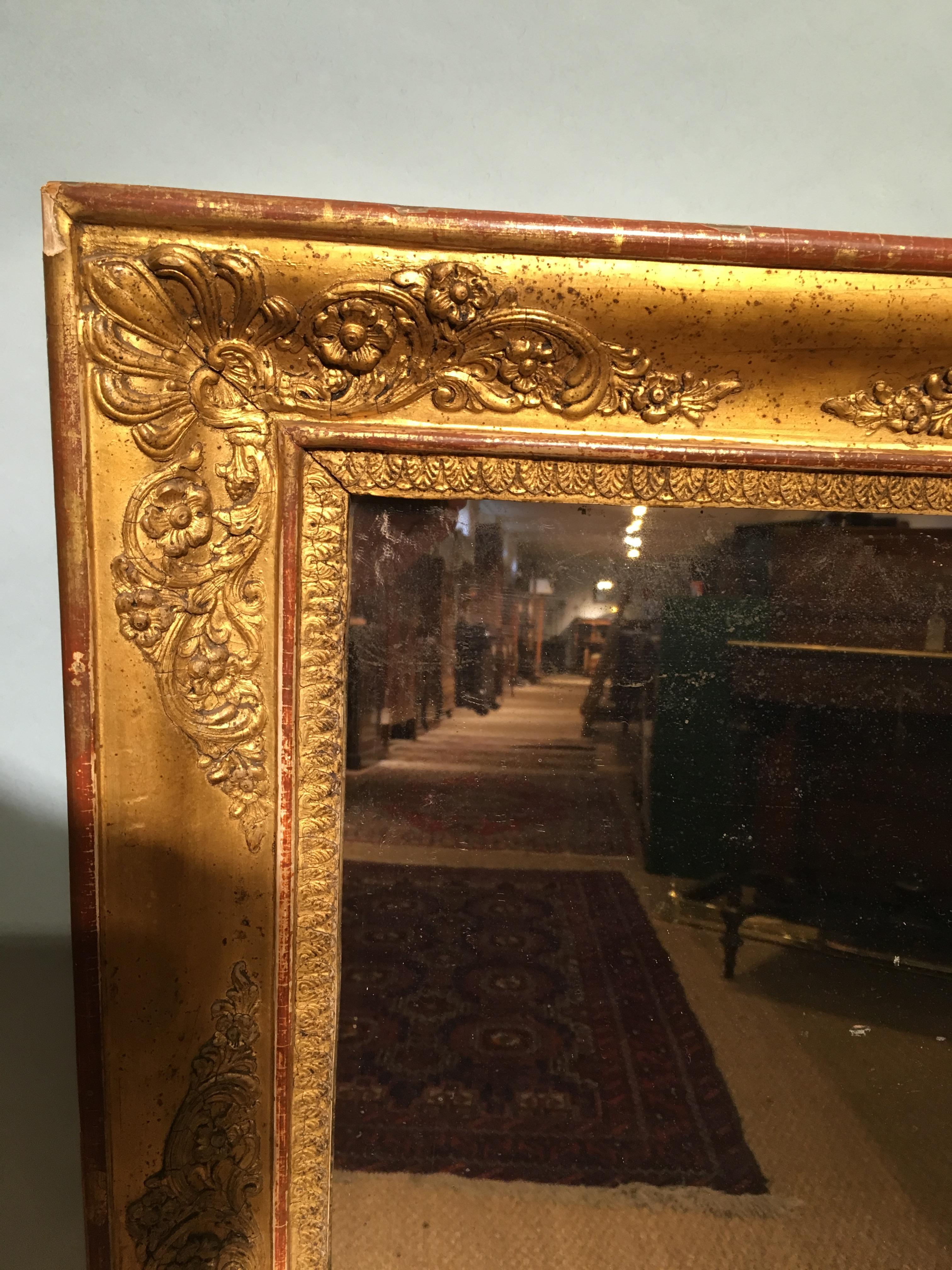 Good 19th century gilt mirror 
French, circa 1850 with original mirror and pine back boards, some blemishes 
Height 36 inches or 91 cms 
Width 33 inches or 84 cms.