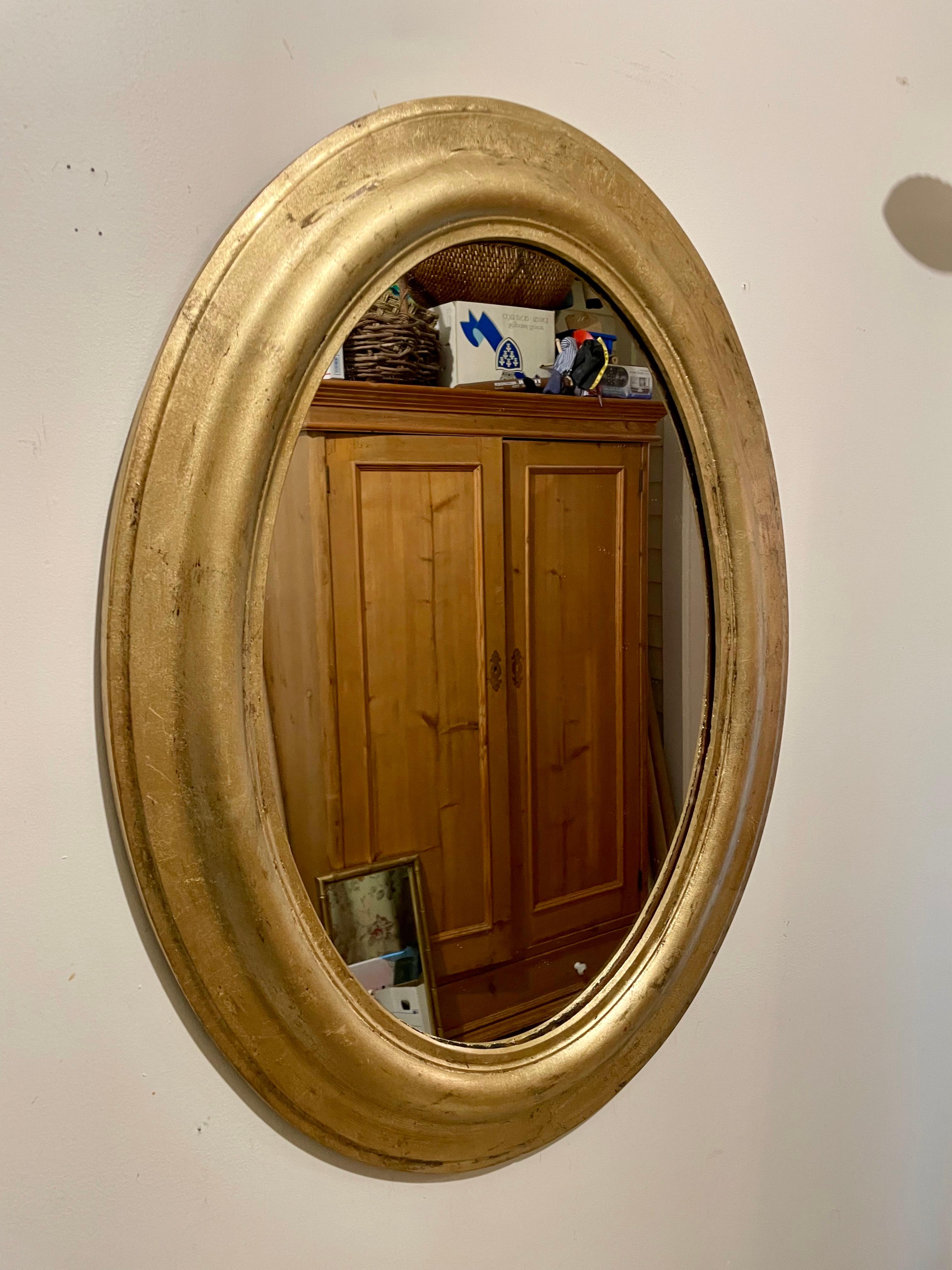 Antique Gilt Oval Italian Mirror. Nice wide frame. 25