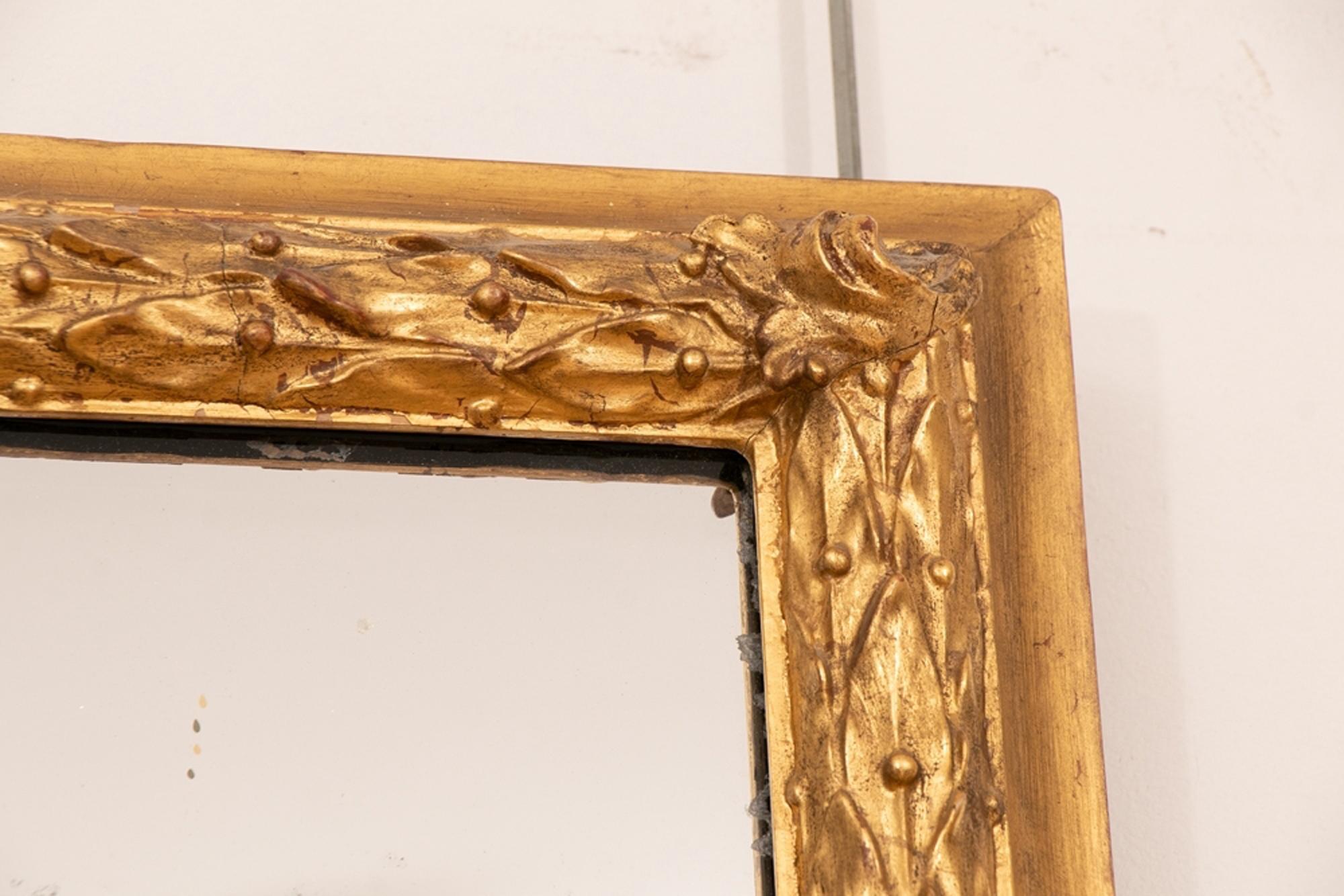 English antique giltwood overmantel mirror, circa 1860. Superb quality 23.5-carat genuine gold leaf water gilding. Original mirror plate with overall foxing, original backing boards. A Victorian mirror fully restored and touch gilded where necessary
