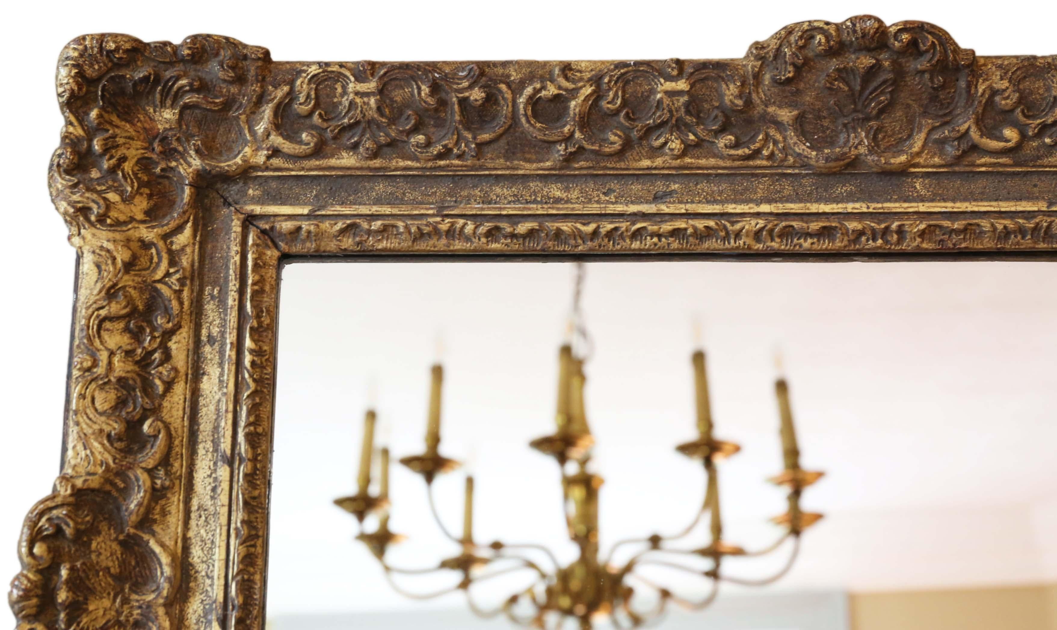 Antique large quality 19th century gilt overmantle or wall mirror. A great look.
A charming mirror, that is full of age and character. Lovely frame with some losses touching up, refinishing and repairs over the years. Most of the original finish