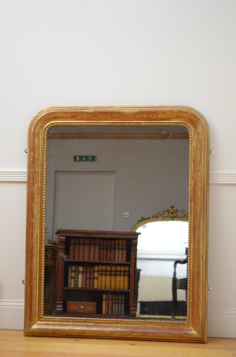 K0455 attractive 19th century gilded pier mirror, having original foxed mirror plate in foliage decorated gilded frame. This antique mirror retains original glass, gilt and backboards, all in home ready condition with some minor wear consistent with