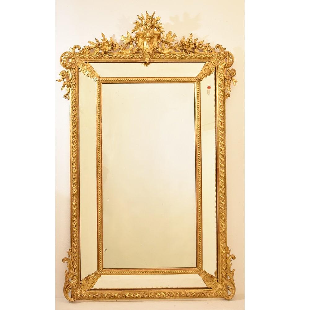 The Antique rectangular gilt wall mirror, old mirror with roses flowers and little birds proposed here.

is an elegant mirror and has a Golden Frame in pure Gold Leaf and it carries side mirrors with rich decorations on the sides.

This antique