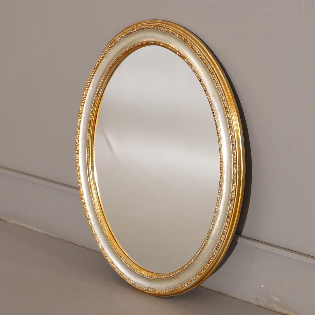 A stylish, rare, large 20th-century French gilt wall mirror, having a scroll frame above an oval bevelled glass plate, 80cm by 60cm.
This mirror can be suitable as a console and pier mirror as well. This gilded oval mirror is a fantastic object as a