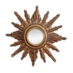 Specchio convesso d'epoca in legno dorato con effetto sunburst