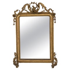 Miroir ancien en bois doré