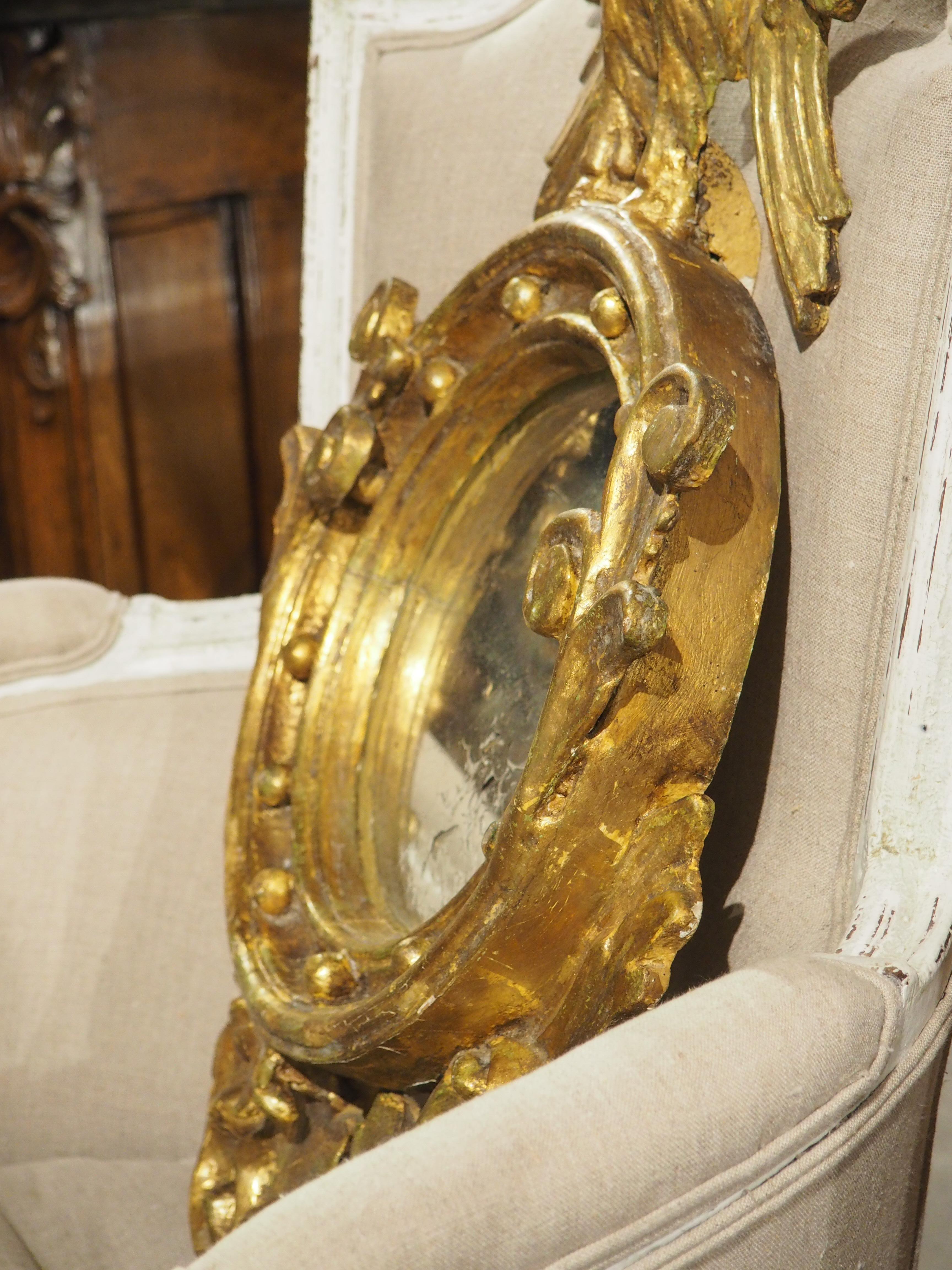 Miroir mural ancien en bois doré avec aigle, vers 1810 en vente 1