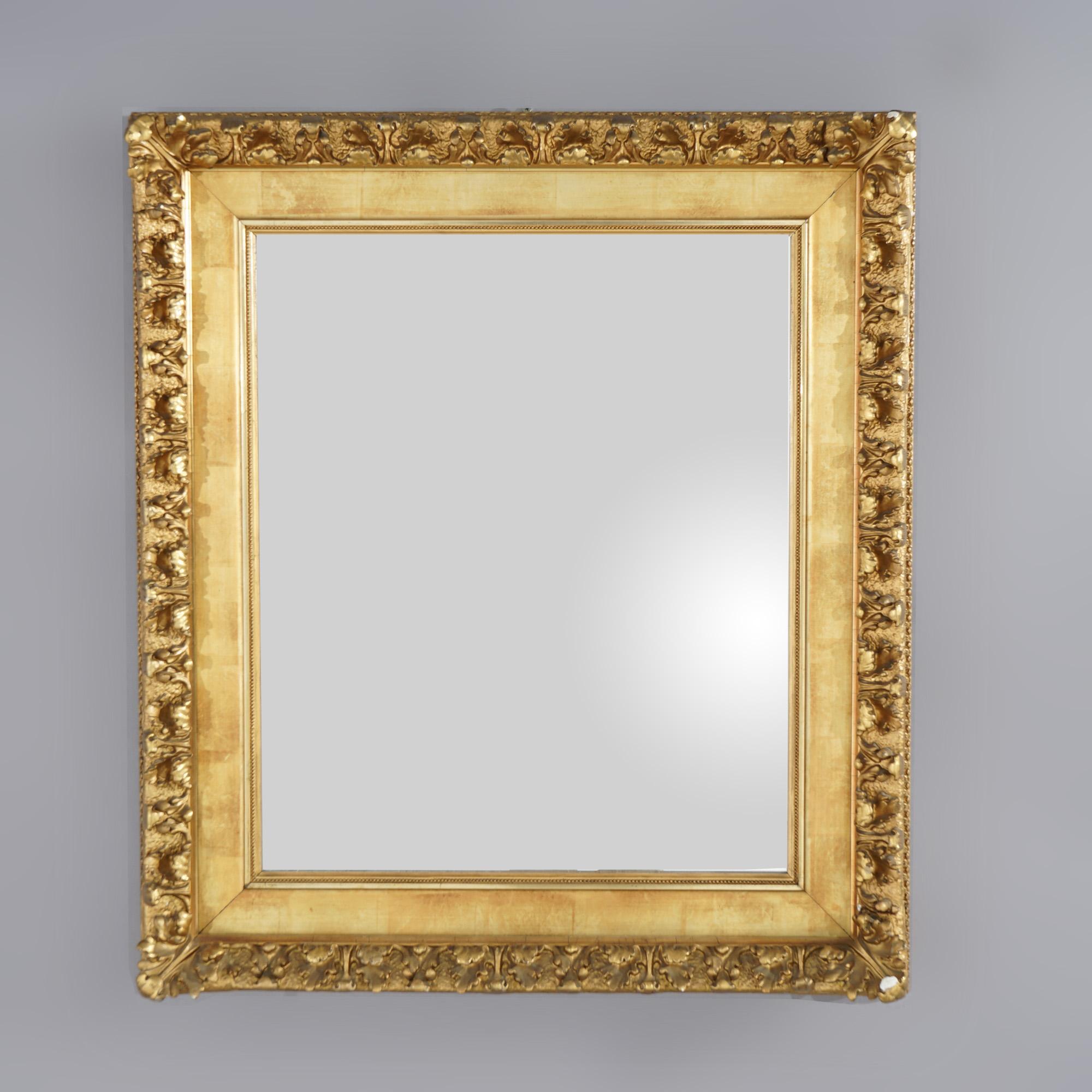 An antique wall mirror offers giltwood construction with high relief foliate elements, 19th century

Measures - 42