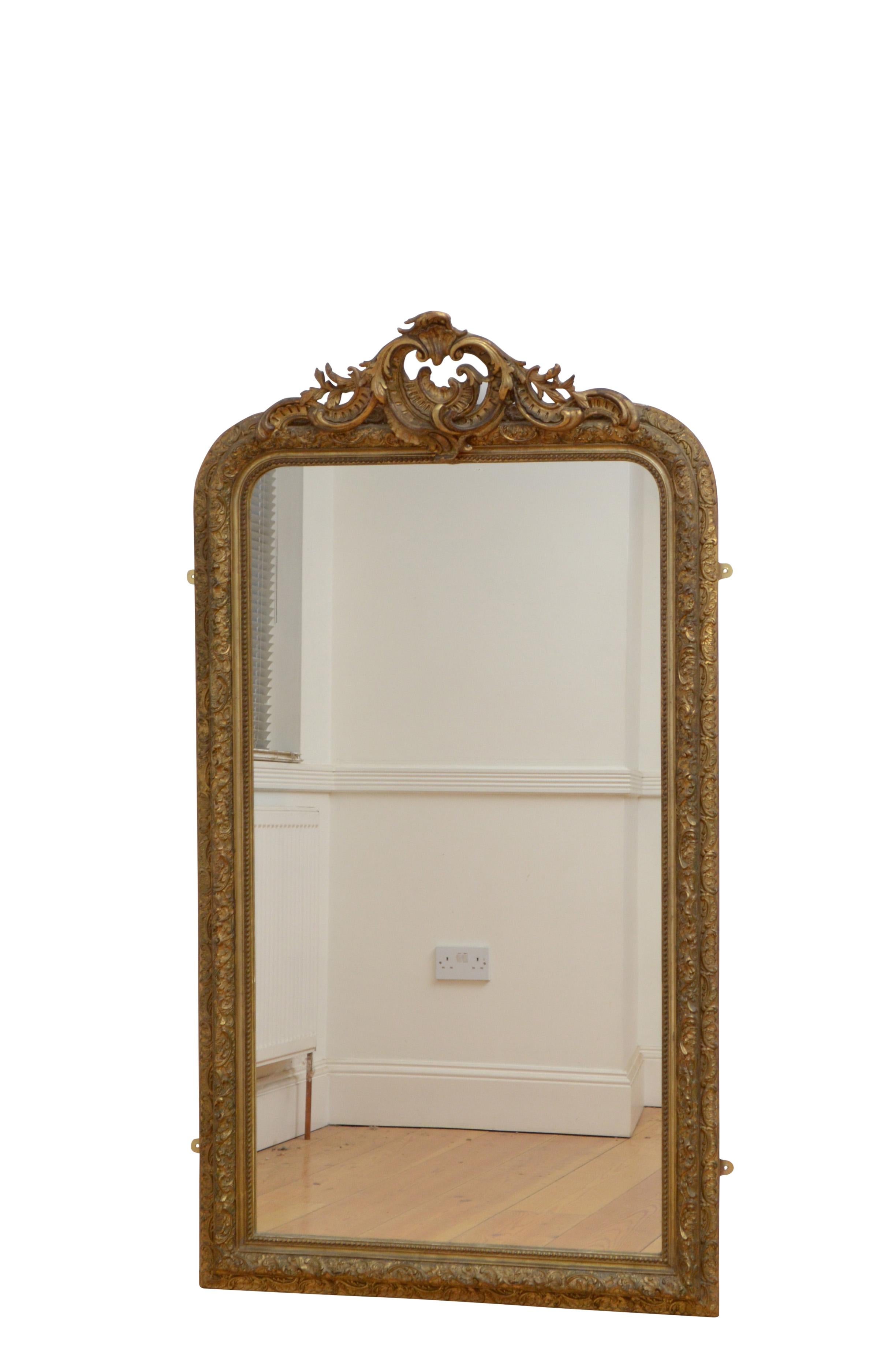 Attractive French gilded wall mirror, having original glass with minor foxing stamped 1898, in giltwood frame carved with ‘les pearls’ which symbolises strand of pearls, and leaf and floral motifs throughout, all adorned with an elaborately carved