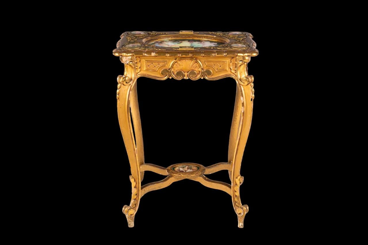Austrian Antique Giltwood table with refined Vienna porcelain stamped plaques. For Sale