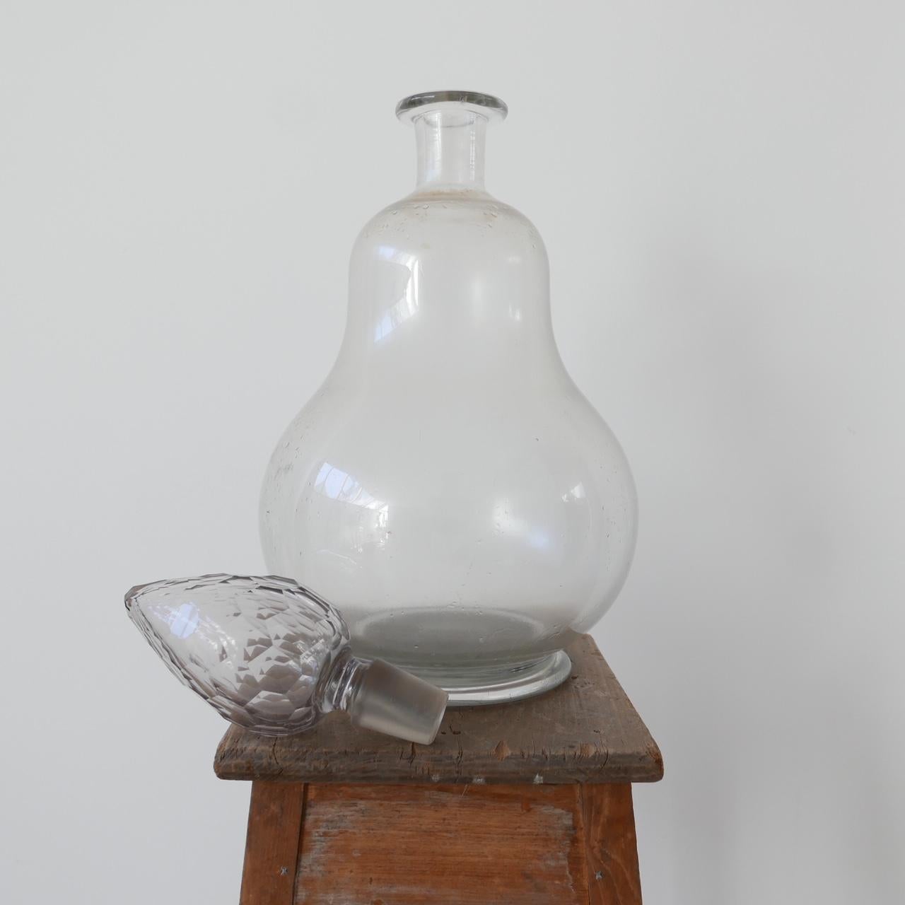 A Victorian glass chemist's advertising carboy.

Late 19th century-early 20th century.

Hand blown glass.

Multifaceted stopper.

Dimensions: 64 height x 30 diameter in cm.


    