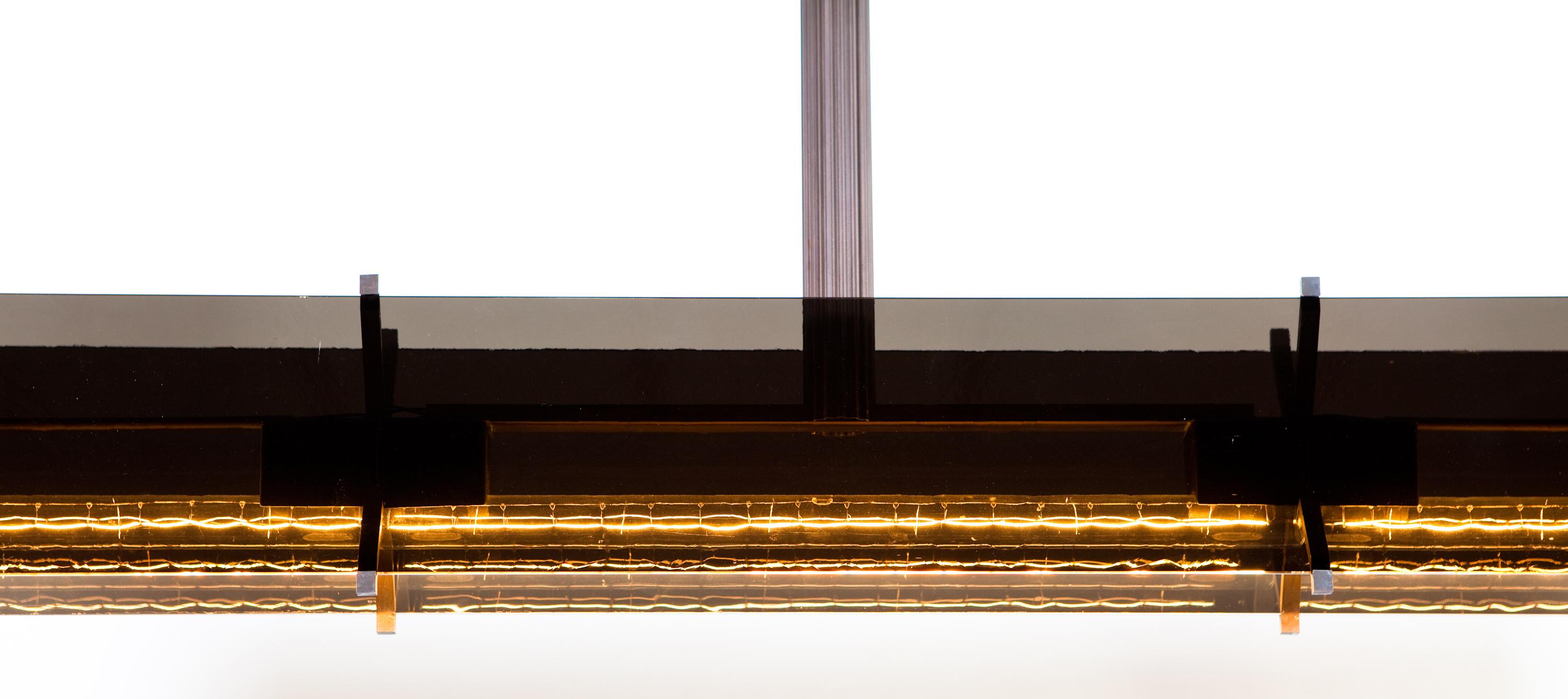 Pendant of brass and dark antique glass
With 3 linestra led lamps with s14s socket of each 50 cm.
    