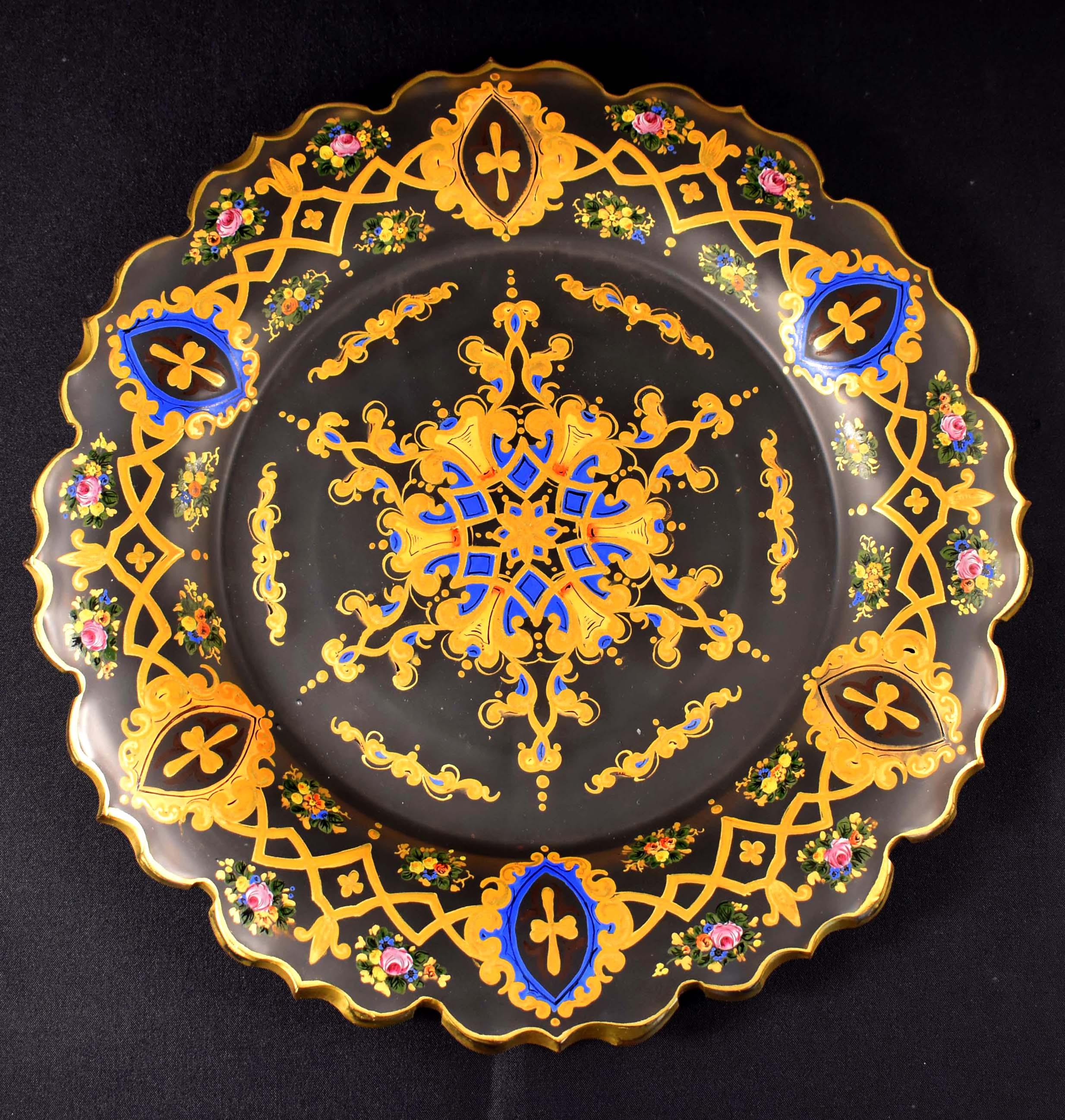 A beautiful antique glass painted plate with a cut edge, the plate is made of matte glass, beautifully painted and supplemented with gilding. It most likely dates from the late 19th or early 20th century. It was most likely made in Bohemia for the