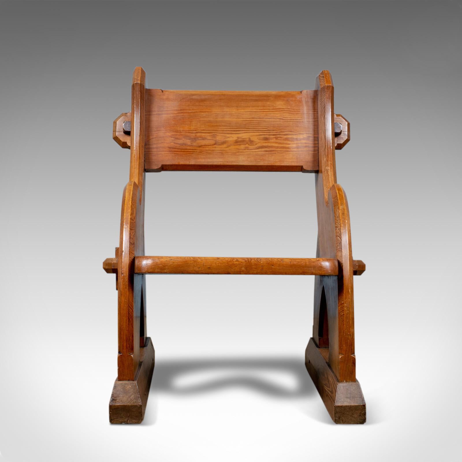 This is an antique Glastonbury chair. An English, Tudor Revival, hall seat with ecclesiastical and Gothic overtones, dating to the mid-19th century, circa 1850.

A fine Glastonbury chair faithful to its origins
Exhibiting ecclesiastical and