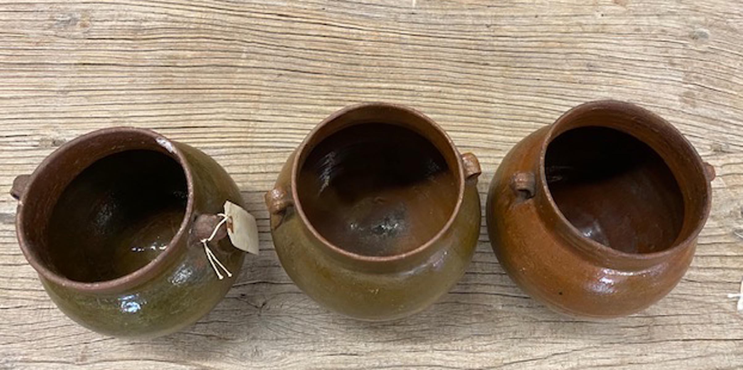Three Guatemalan antique glazed ceramic jars, sold separately. Please refer to left, middle or right when purchasing
Left measures 6.5 D x 7 H
Middle: 7 D x 7.5 H
Right: 6.5 D x 7.5 H.