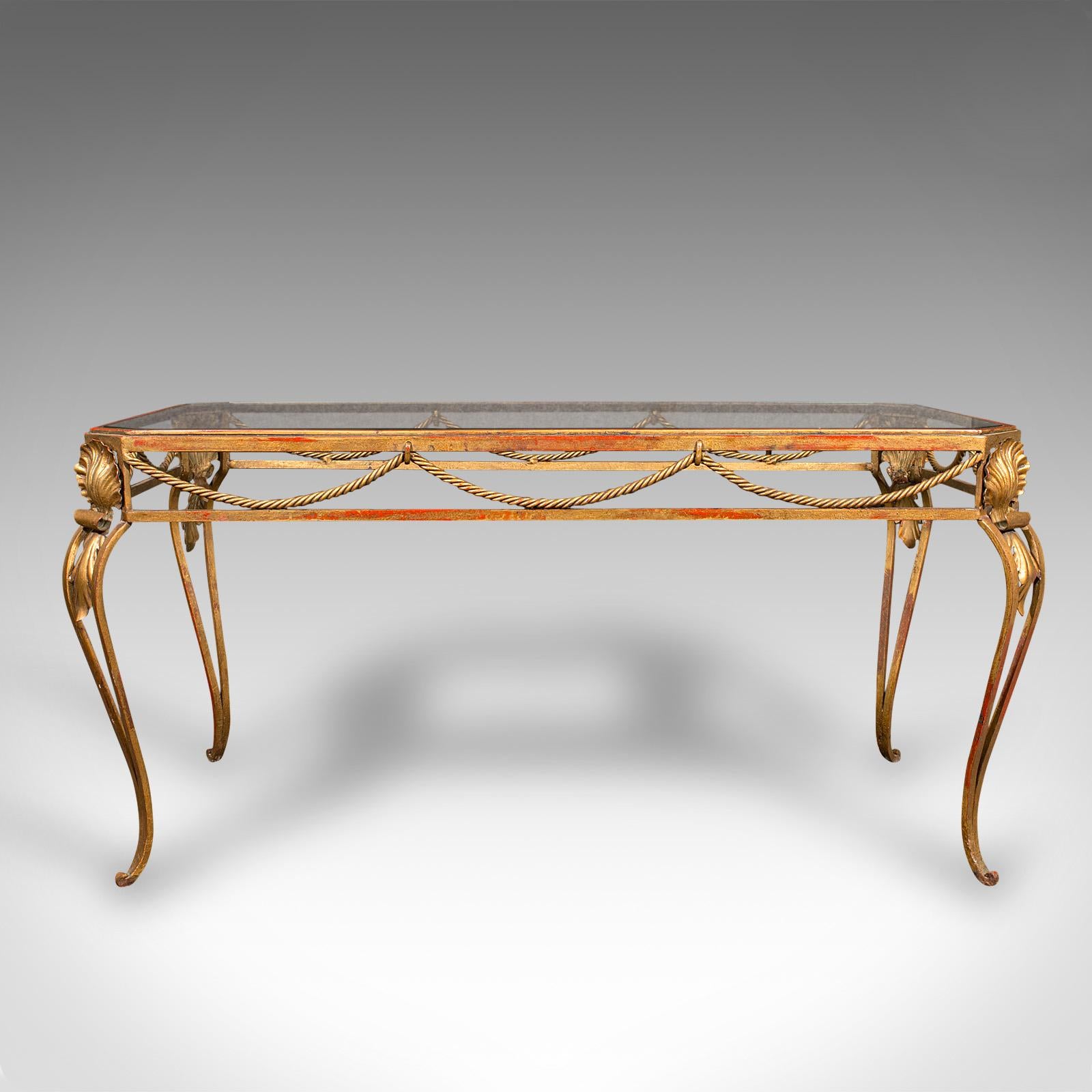 This is an antique glazed coffee table. A French, brass framed accent table in Art Nouveau taste, dating to the early 20th century, circa 1920.

Striking appearance and of superb Art Nouveau appeal
Displays a desirable aged patina throughout
Brass