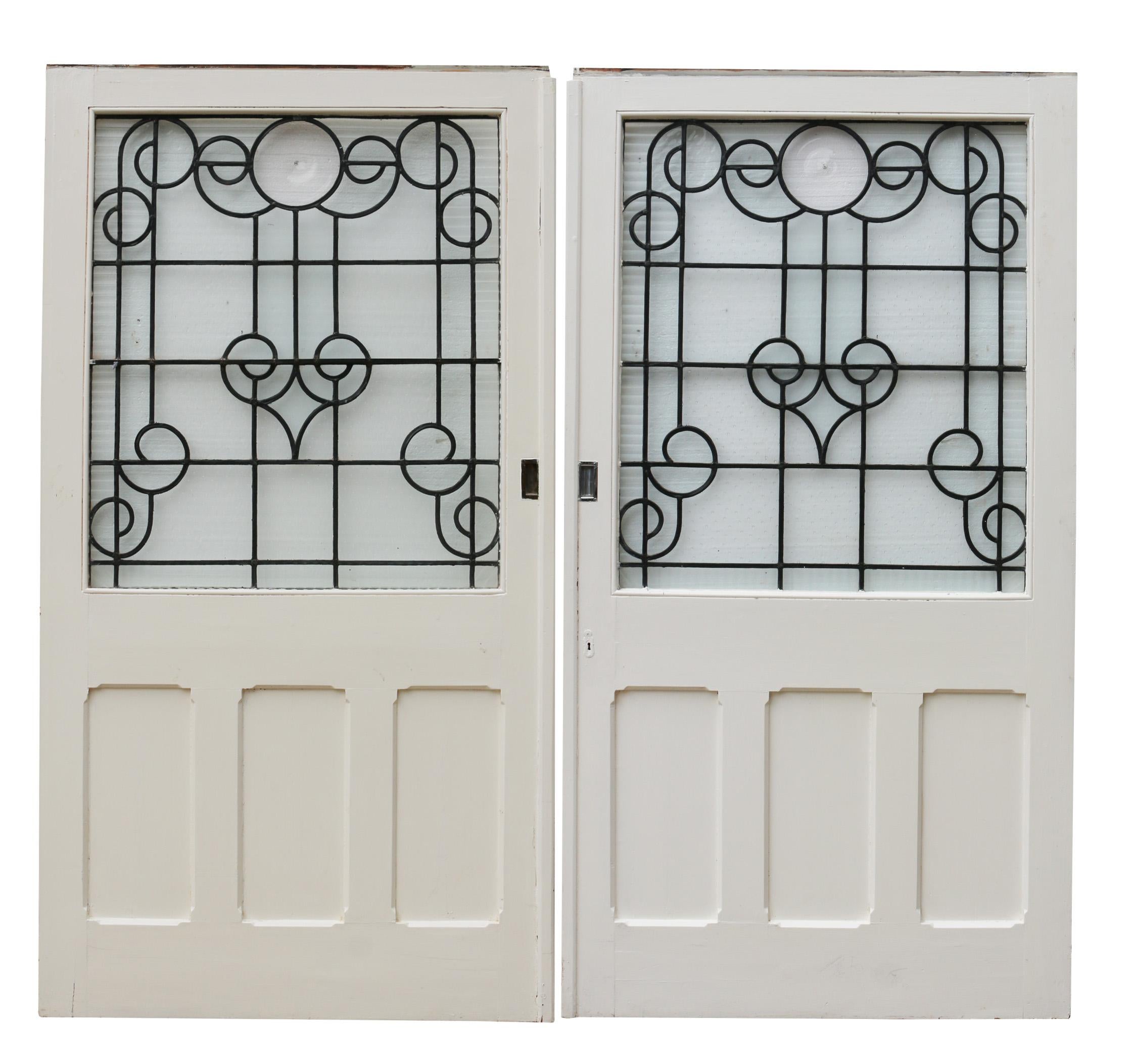 These have previously been used as sliding doors, they could however be fitted with butt hinges. The glazing is a mixture of clear, obscured and textured glass.