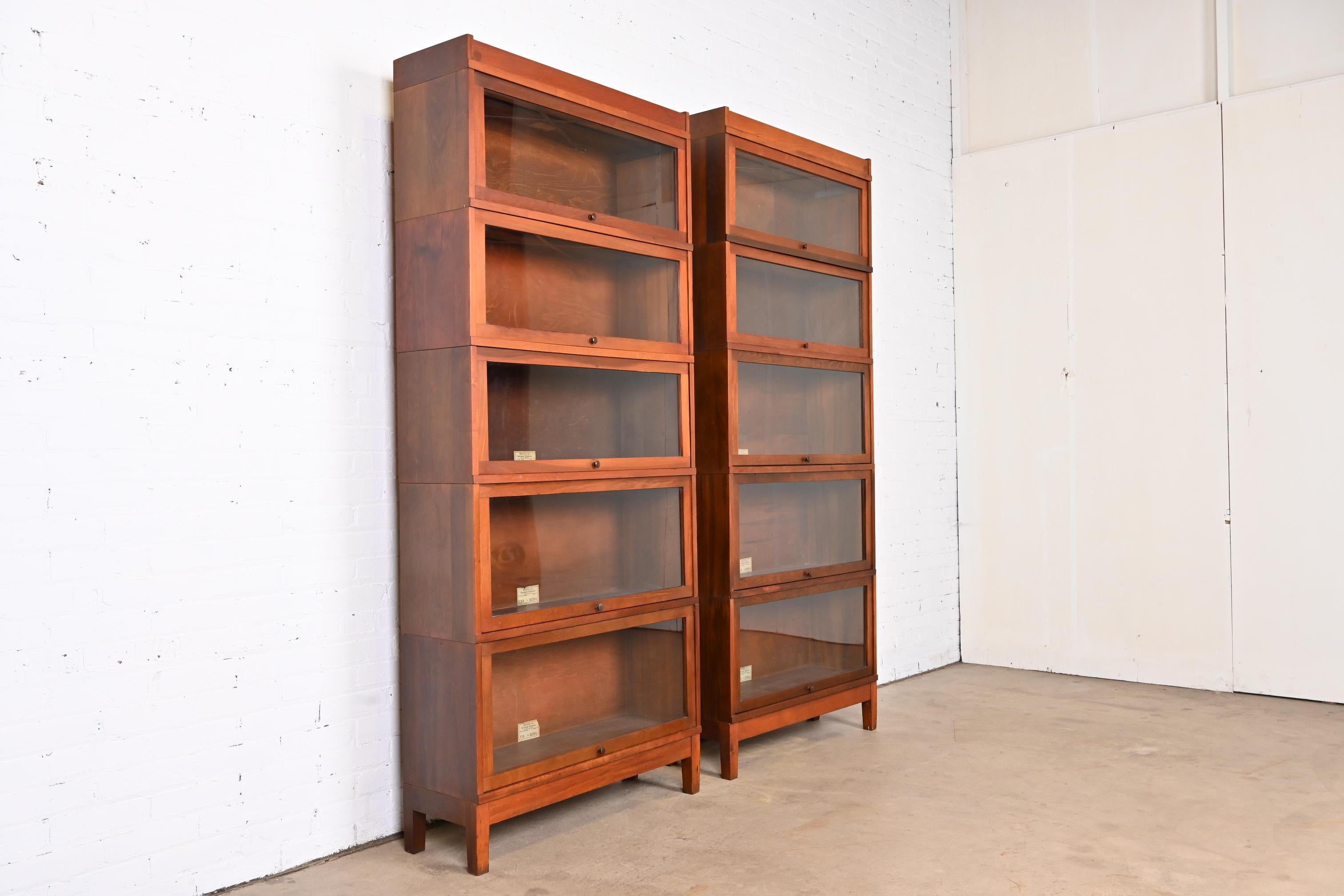 An exceptional pair of antique Arts & Crafts five-stack barrister bookcases

By Globe Wernicke

USA, Circa 1900

Mahogany, with glass front doors and brass hardware.

Measures: 33.75