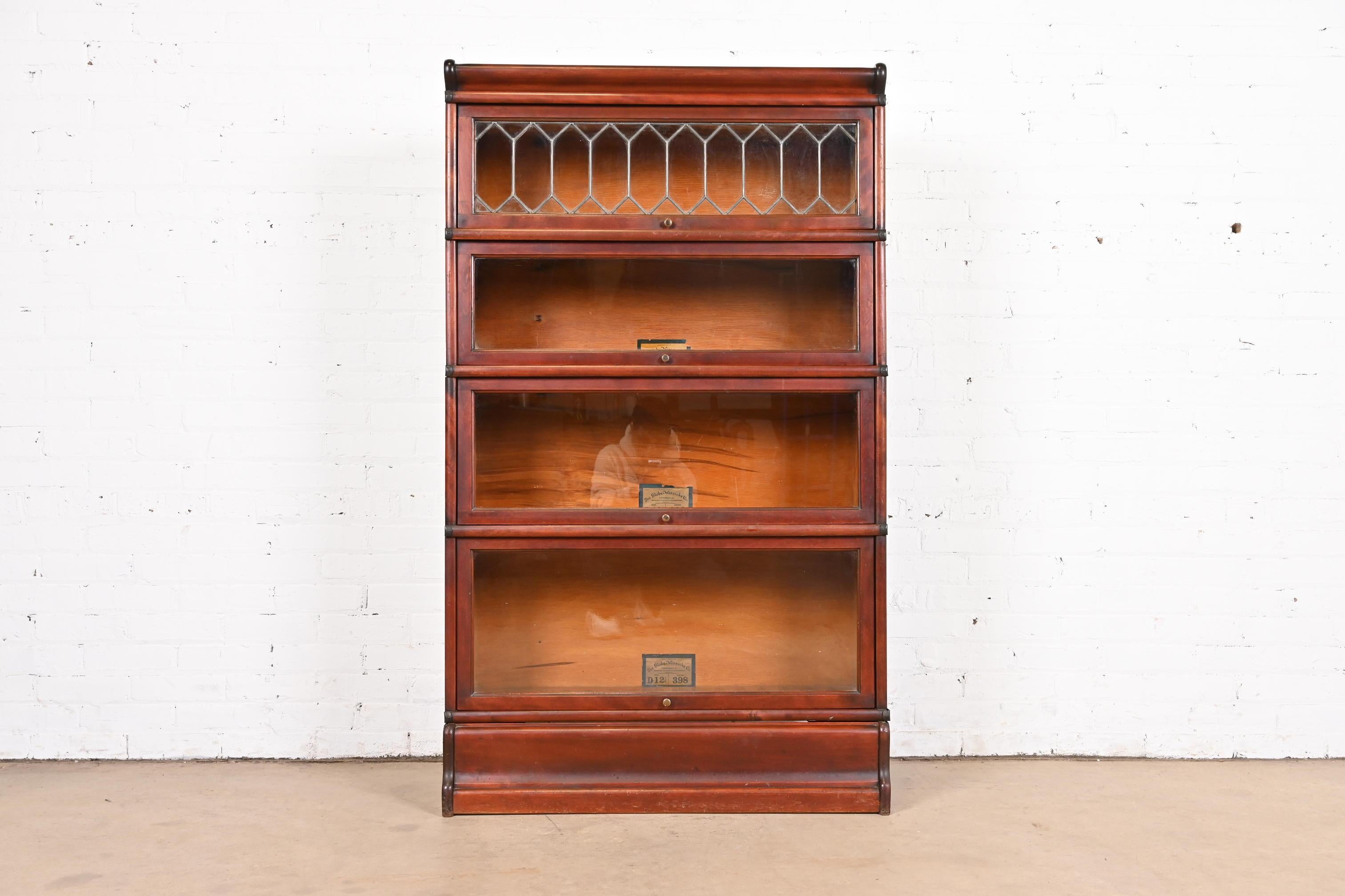 A gorgeous antique Arts & Crafts four-stack barrister bookcase with leaded glass

By Globe Wernicke

USA, Circa 1900

Mahogany cases, with glass front doors and original brass hardware.

Measures: 34